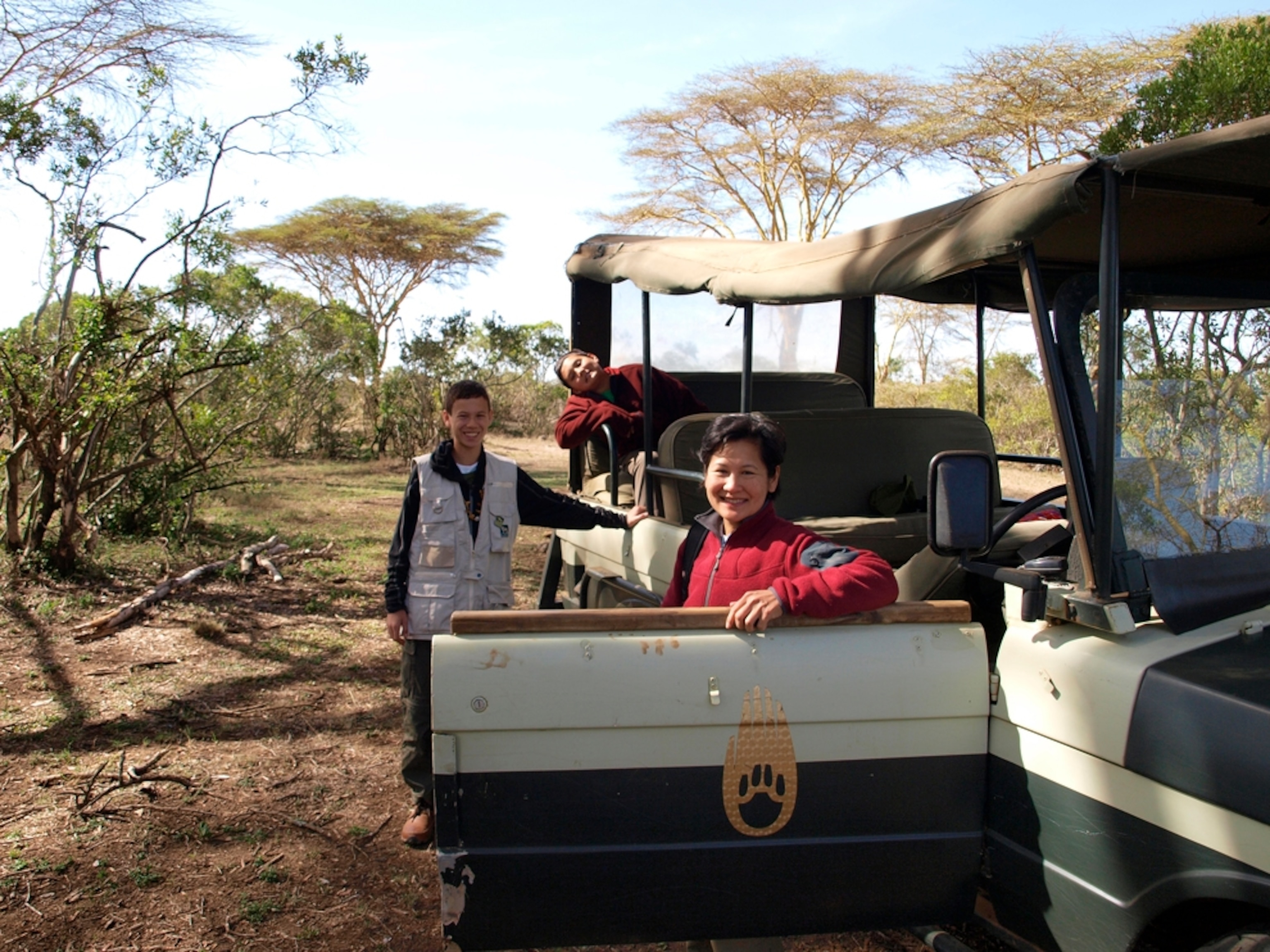 Norie Quintos and sons during safari, Kenya, Africa