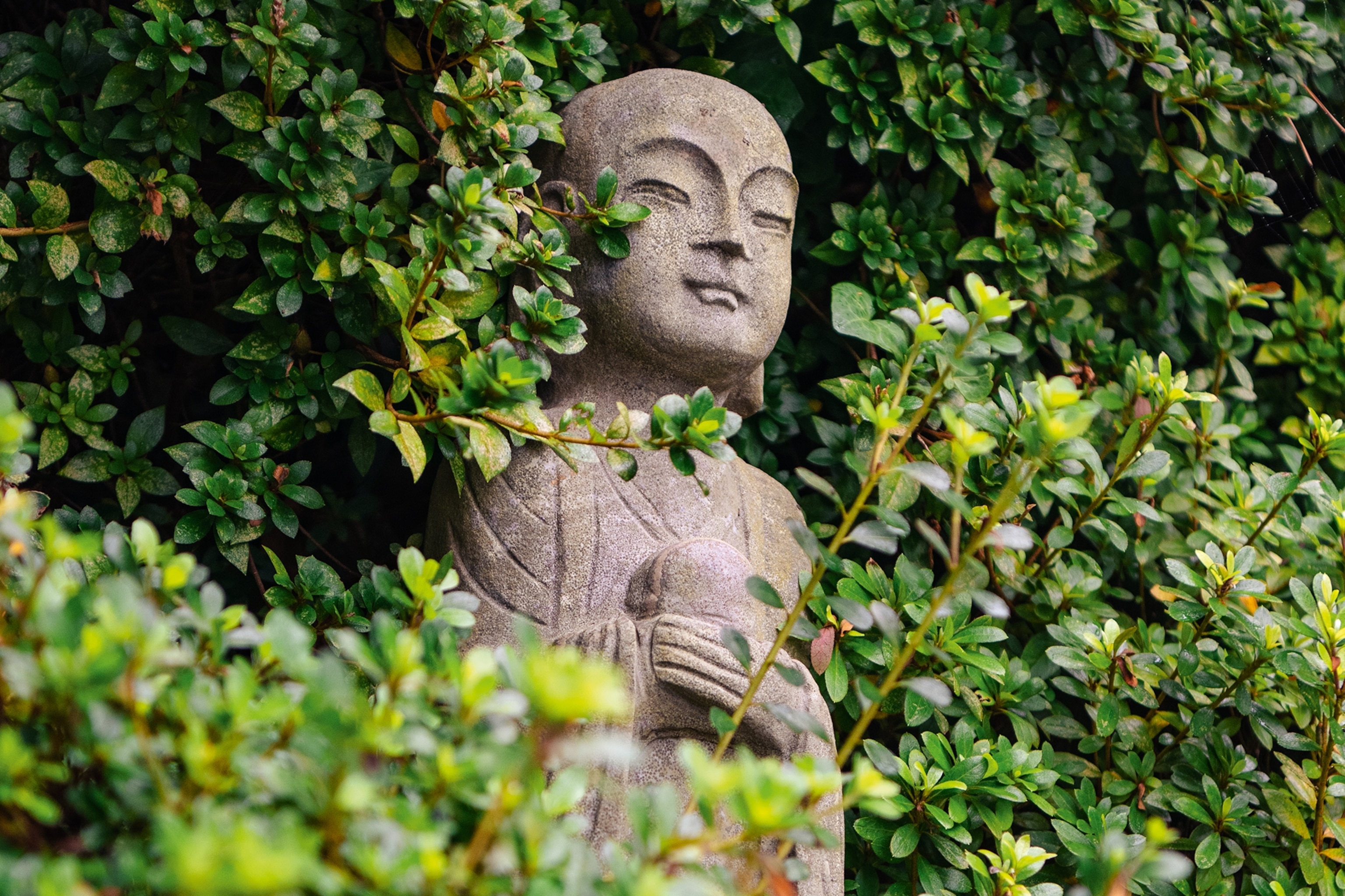 Sea goddess statue amongst shrubbery