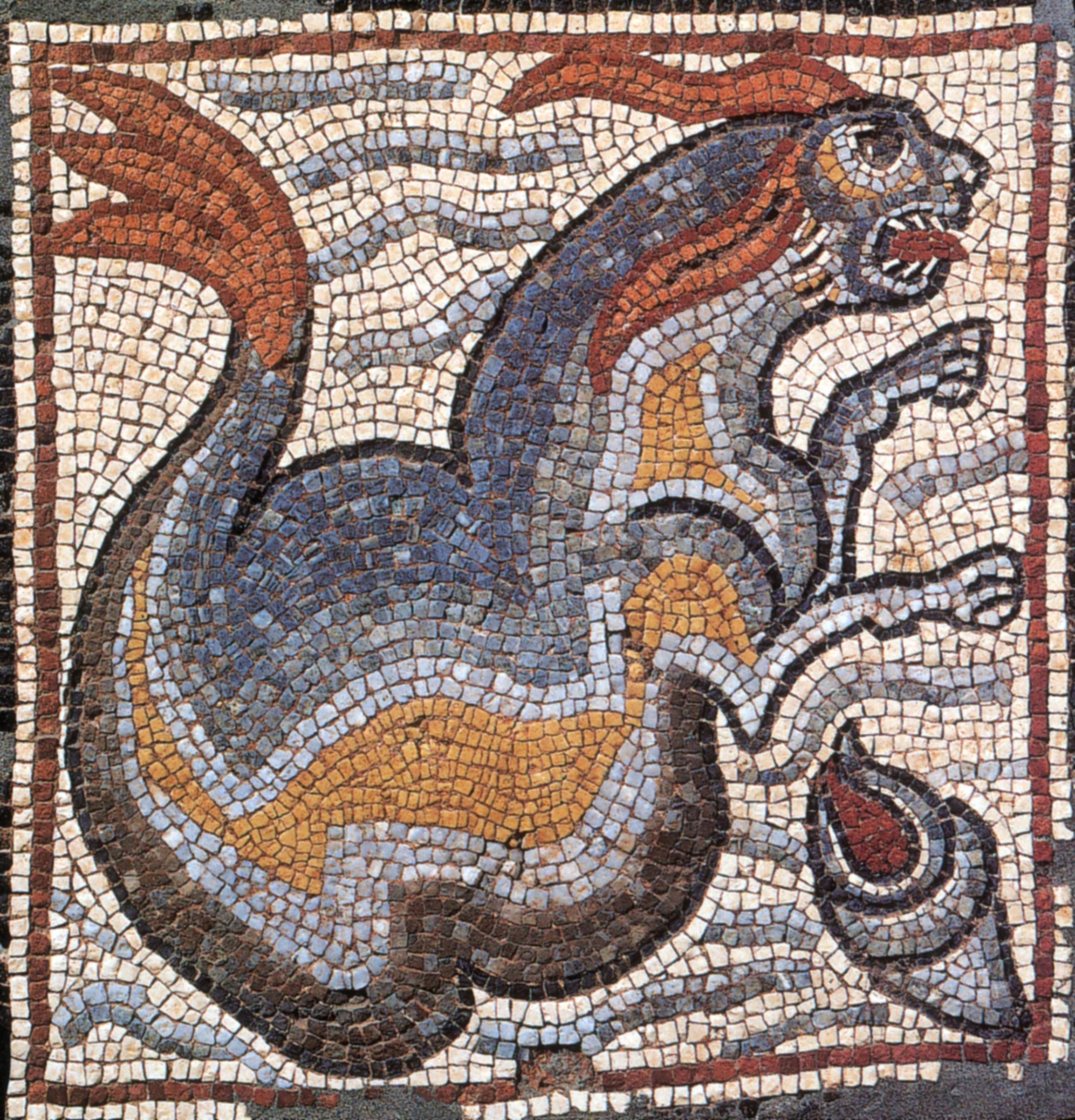 A mosaic depicting a sea monster, its body a mix of gold, blue, grey, and brown, with red fins