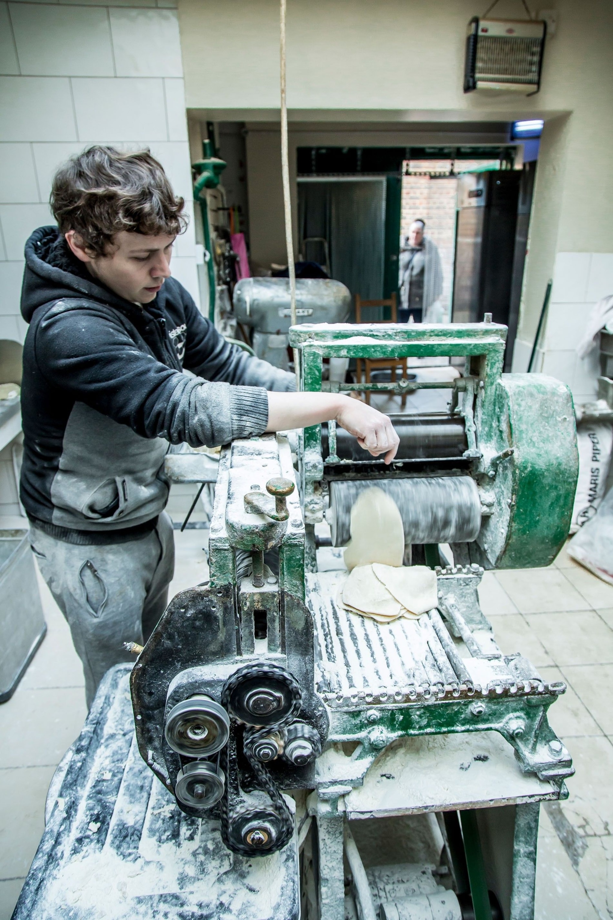 Sonny flattens the shortcrust with a 100-year-old mangle