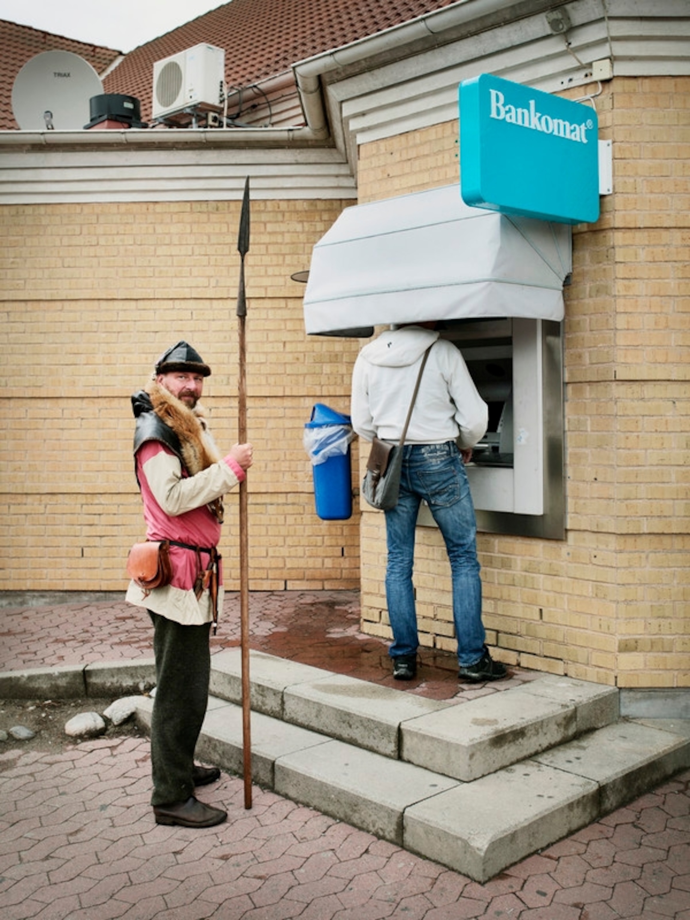 Holger Braumann, a german reenactment guy, who has a role as a fisherman during the reenactment at Foteviken, Sweden. The picture was taken at the &quot;Toppen&quot; mall next to viking village, were many Viking travel to buy supplies and take out money during the viking festival.
