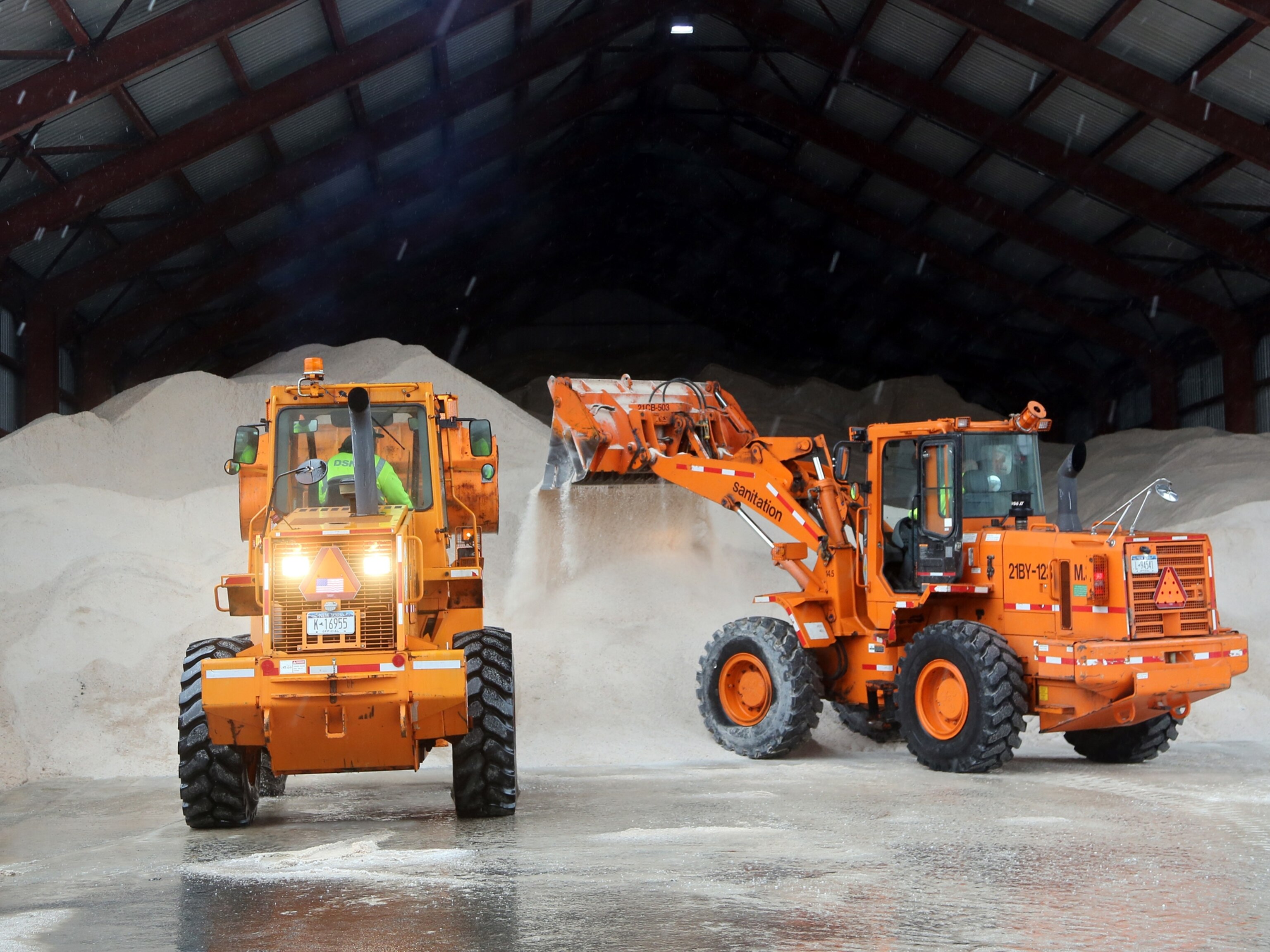Tractors pile up salt at a New York depot