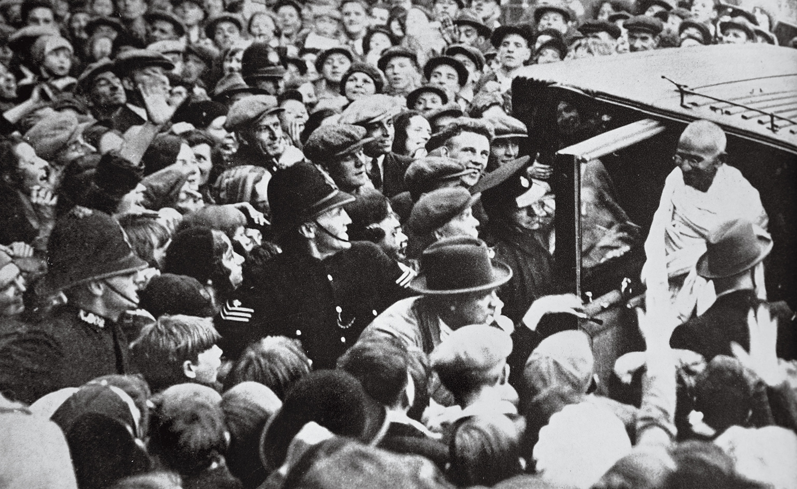 A London crowd greets Gandhi.