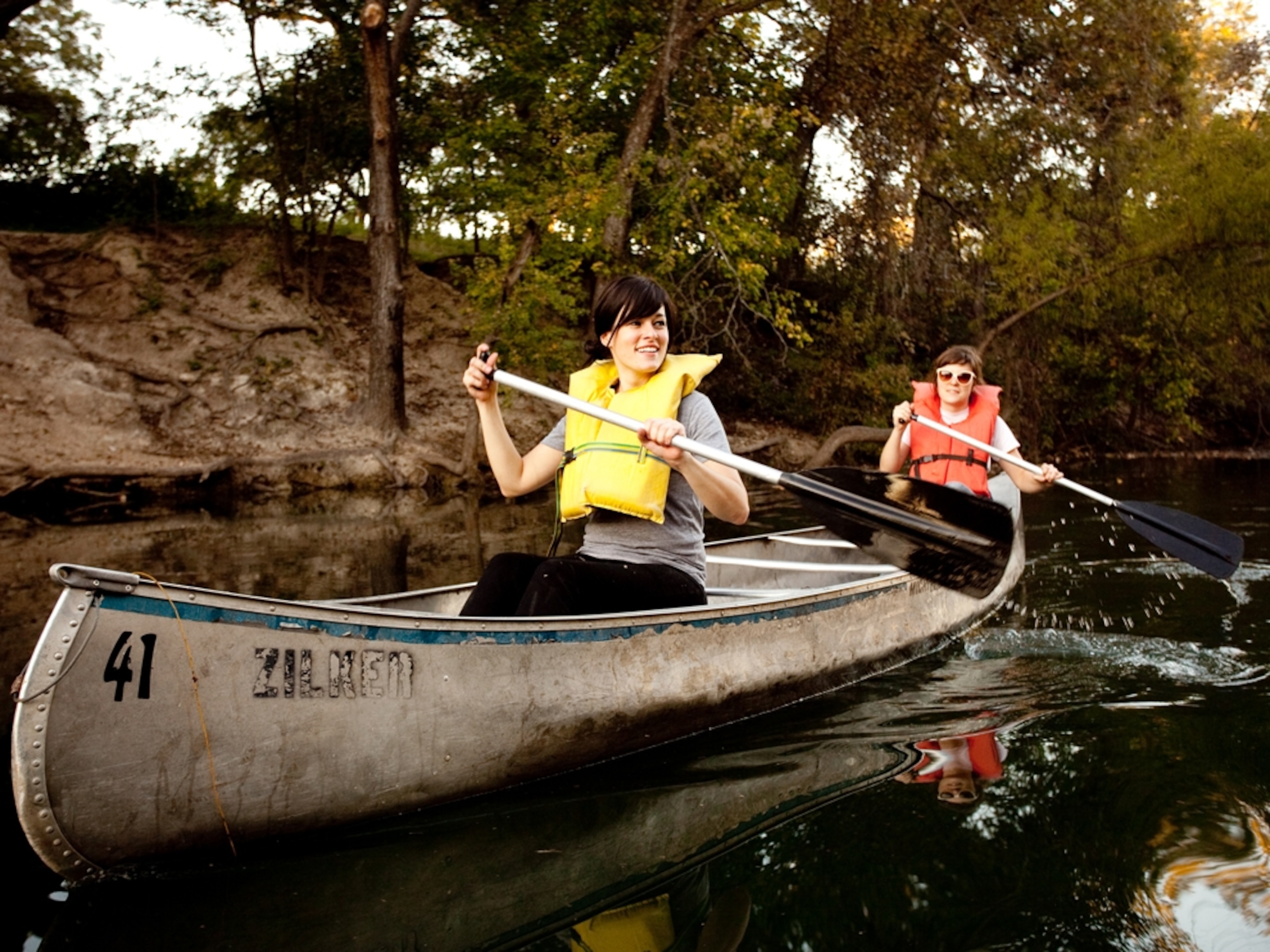 Paddlers canoe Lady Bird Lake.
