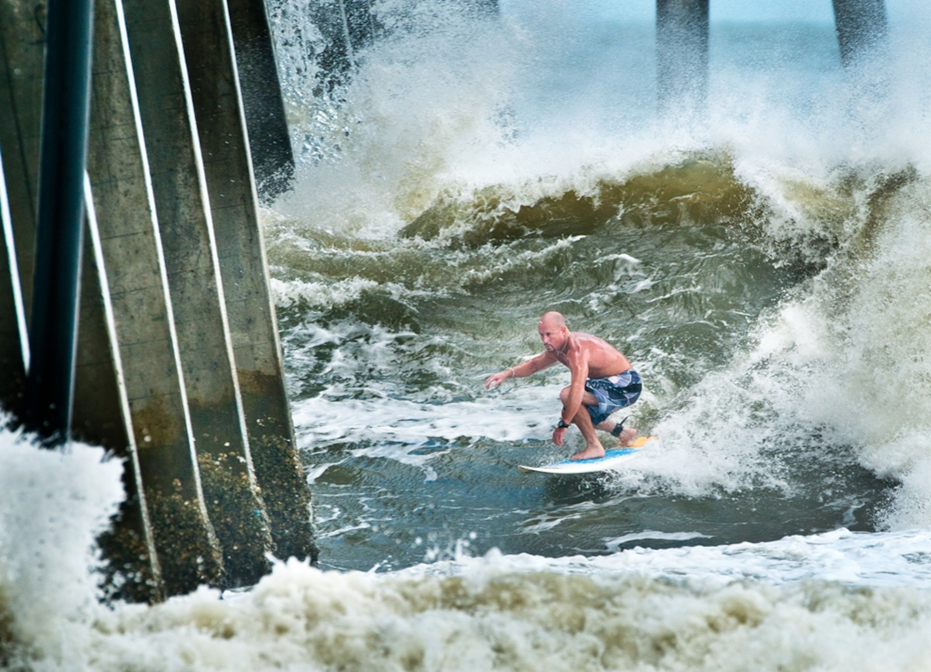 Hurricane Irene picture: a surfer riding wind-whipped waves