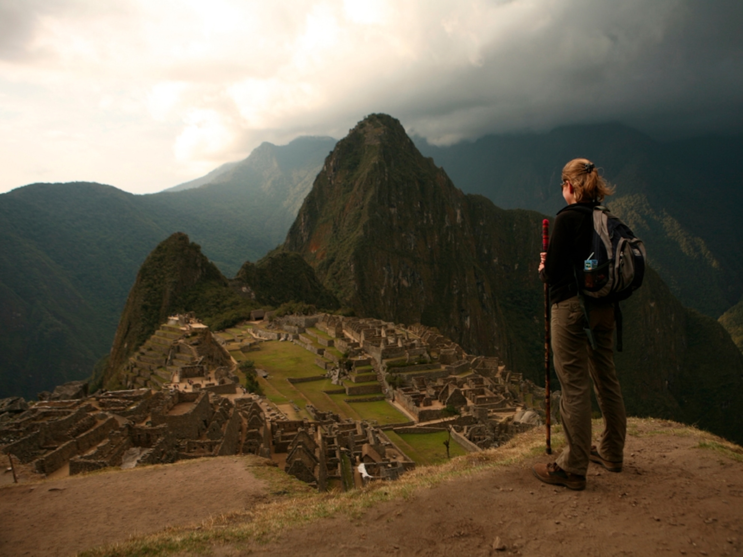 Hiker looks at Huayna Picchu, Peru