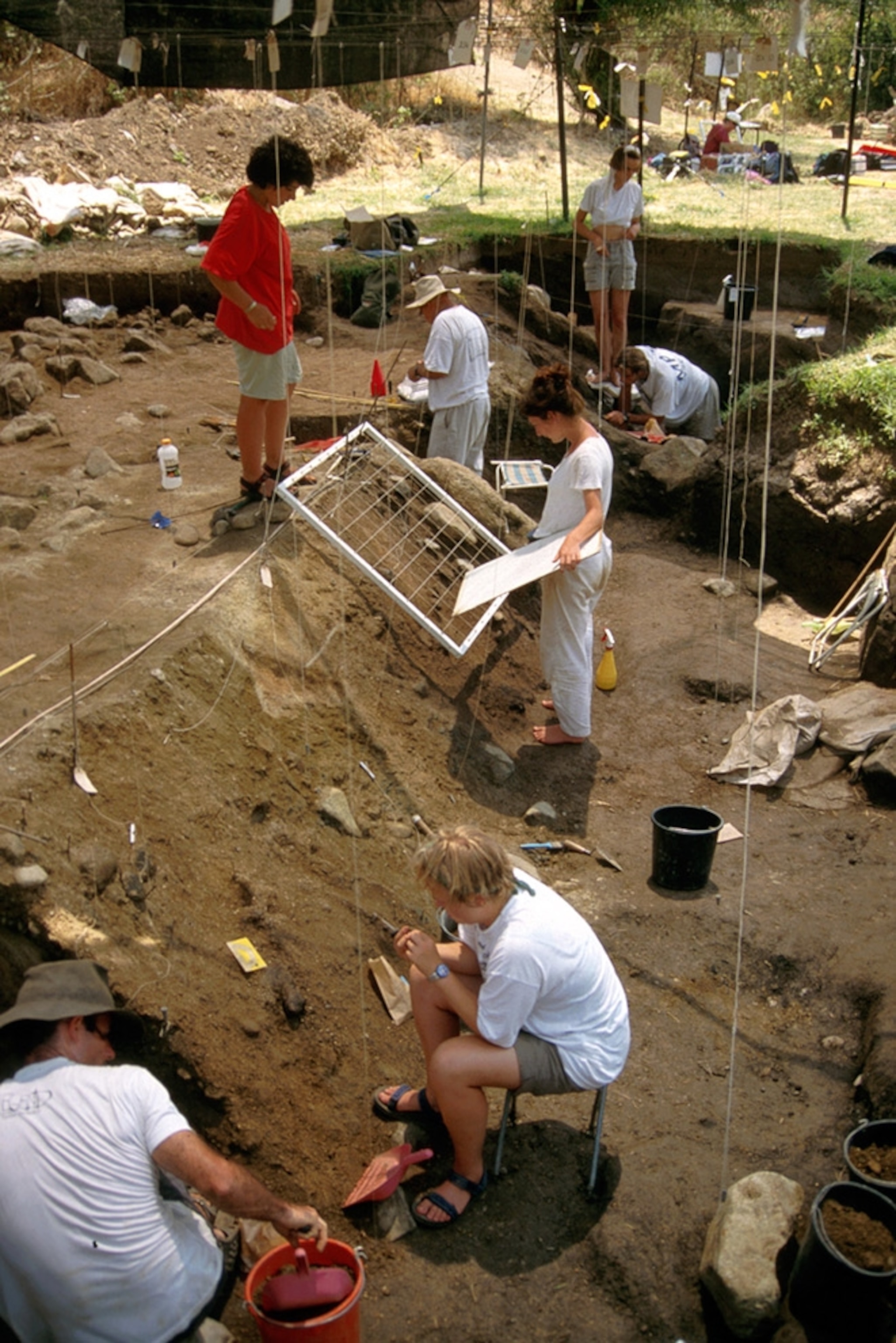 Workers digging at the Gesher Benot Ya'aqov site archaeological site in Israel