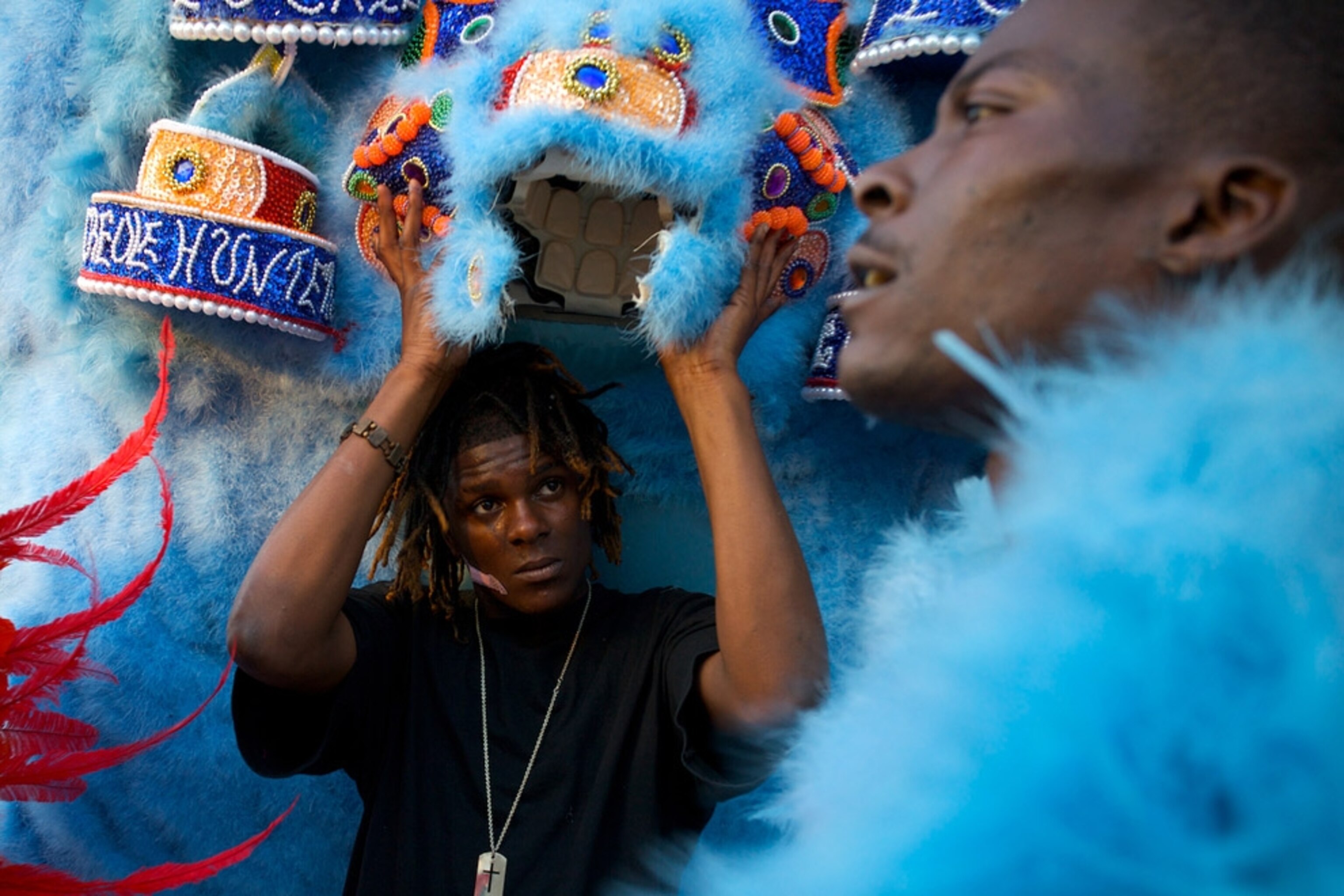 Man holding blue headdress