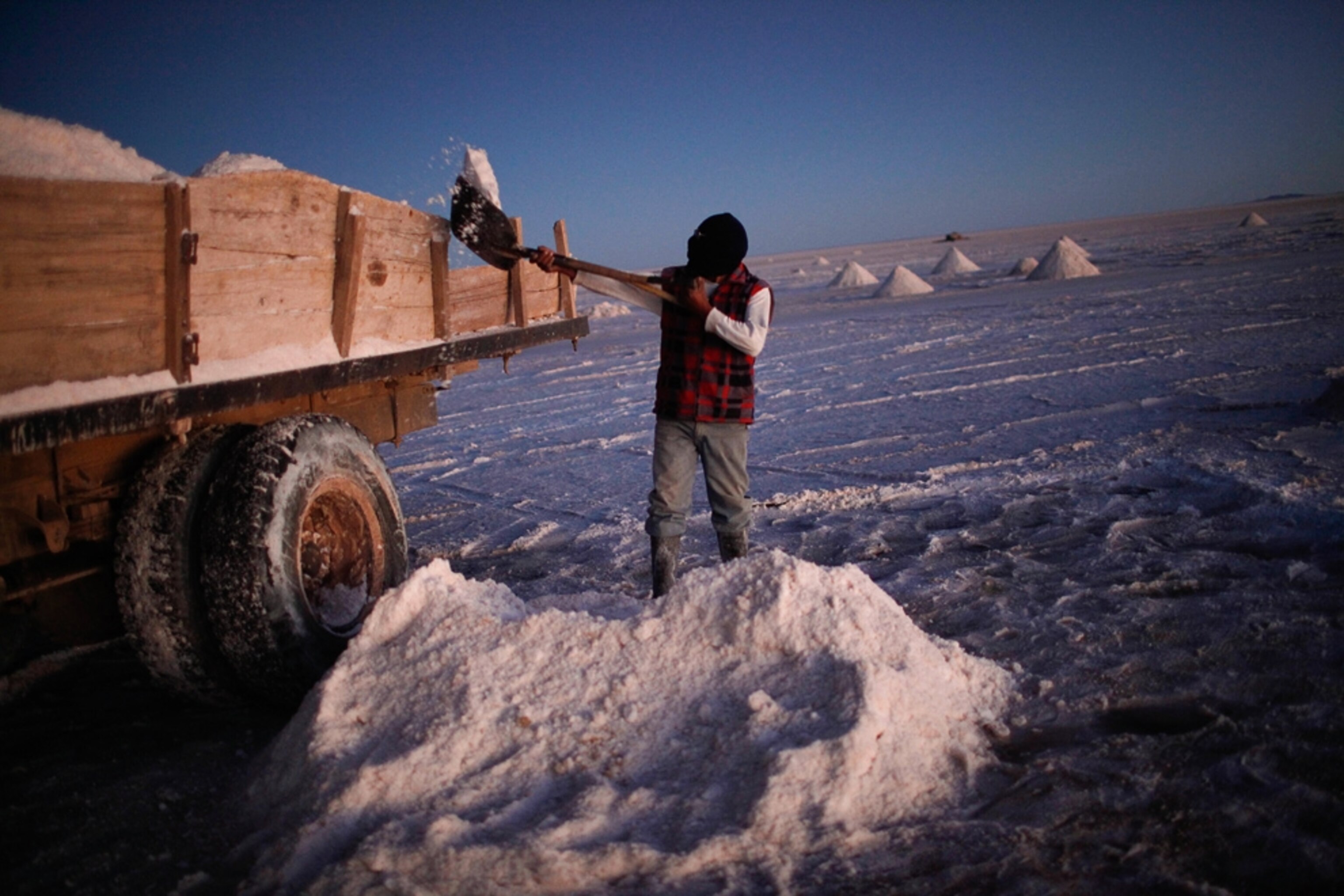 A miner loads his truck with salt to be refined and sold as edible salt in the Uyuni salt desert