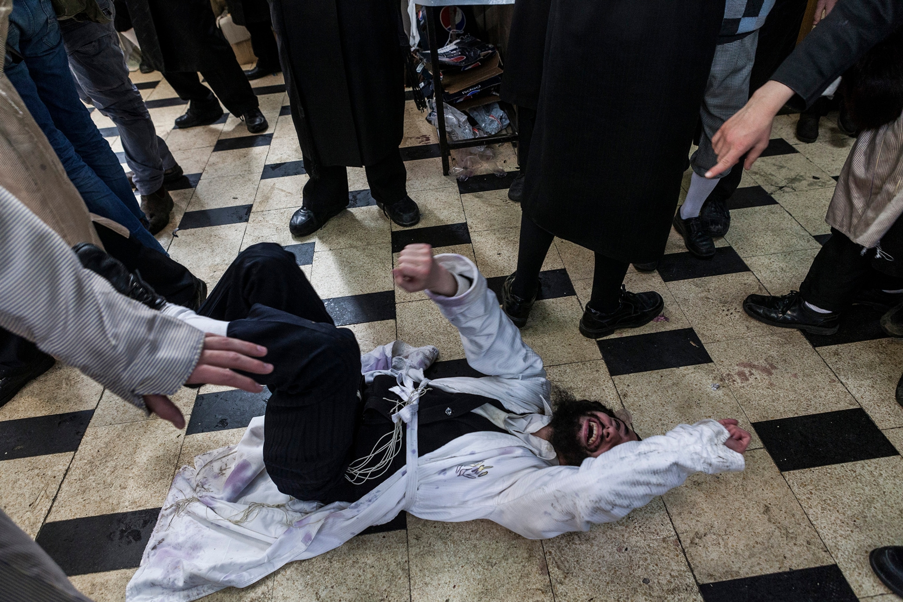 a man lying on the synagogue floor