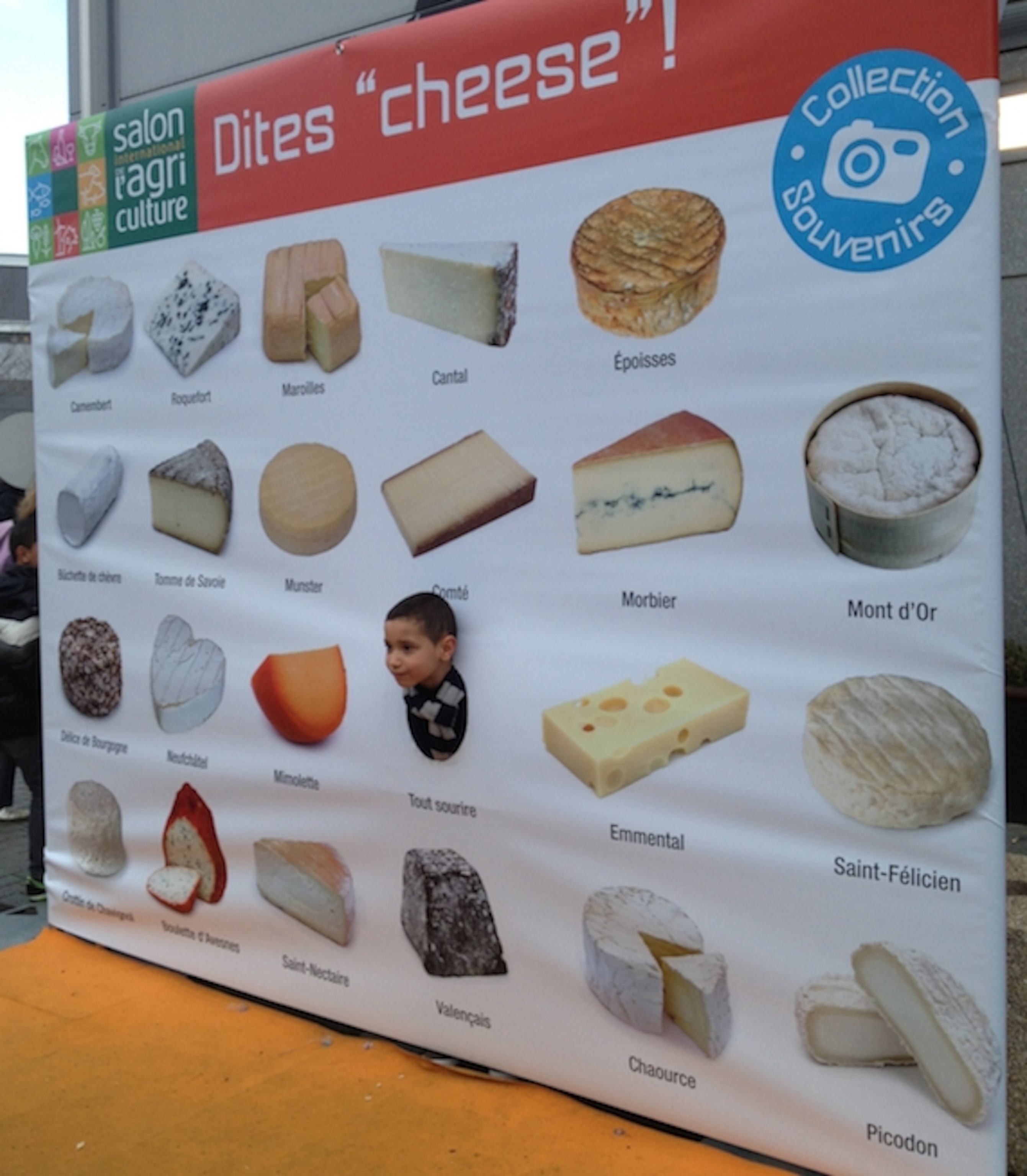 a kid in a cheesy sign.