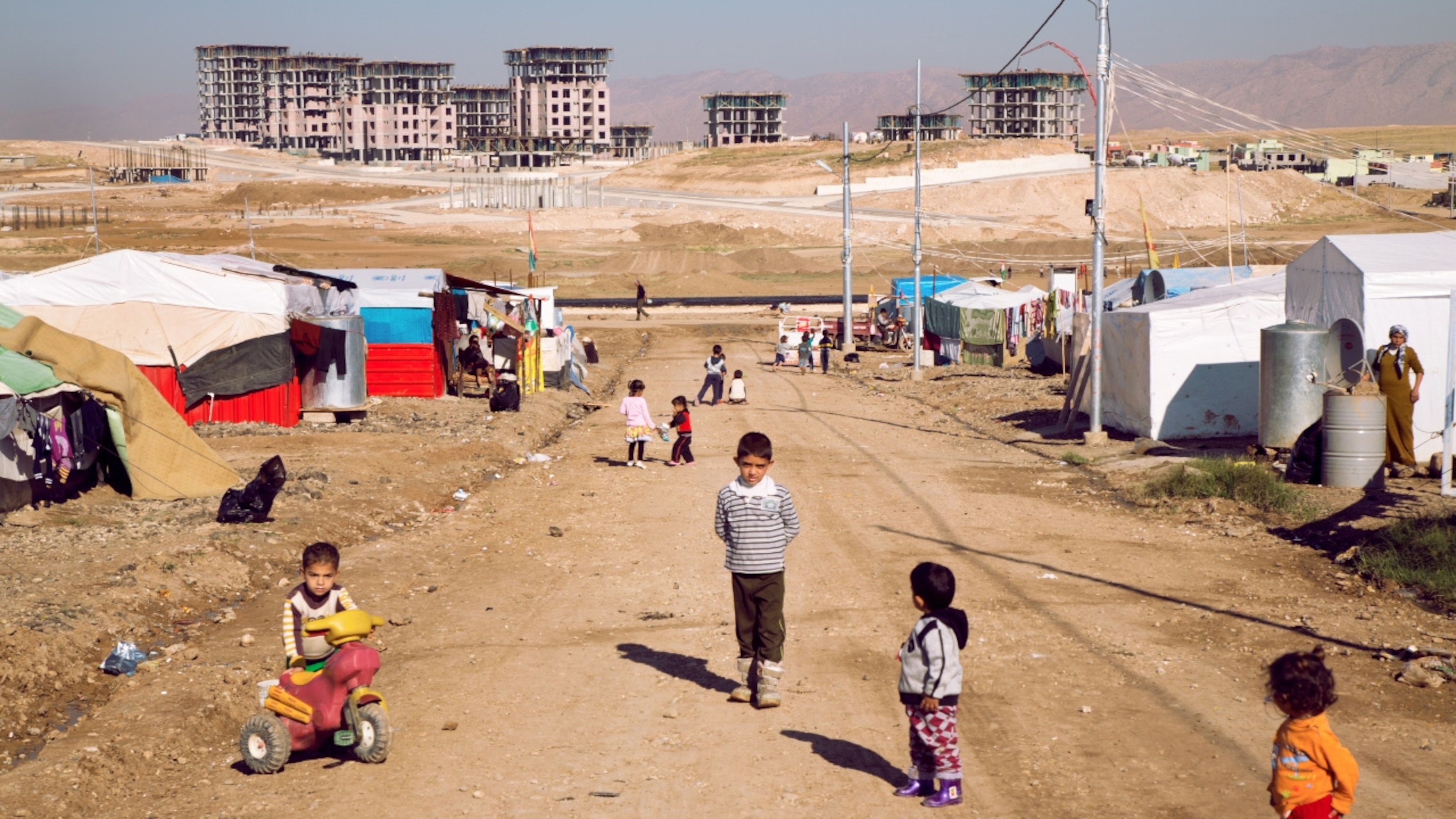 Children play in the Domiz camp for Syrian refugees just outside of Dohuk, Iraq. There are approximately 40,000 Syrian refugees, mostly Kurds, at this camp, as a result of the Syrian civil war.