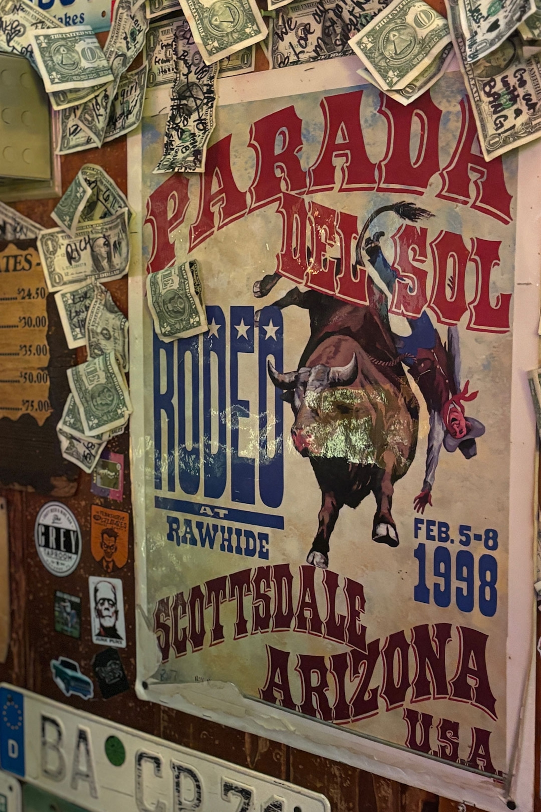 Retro Parada del Sol poster on wall surrounded by dollar bills