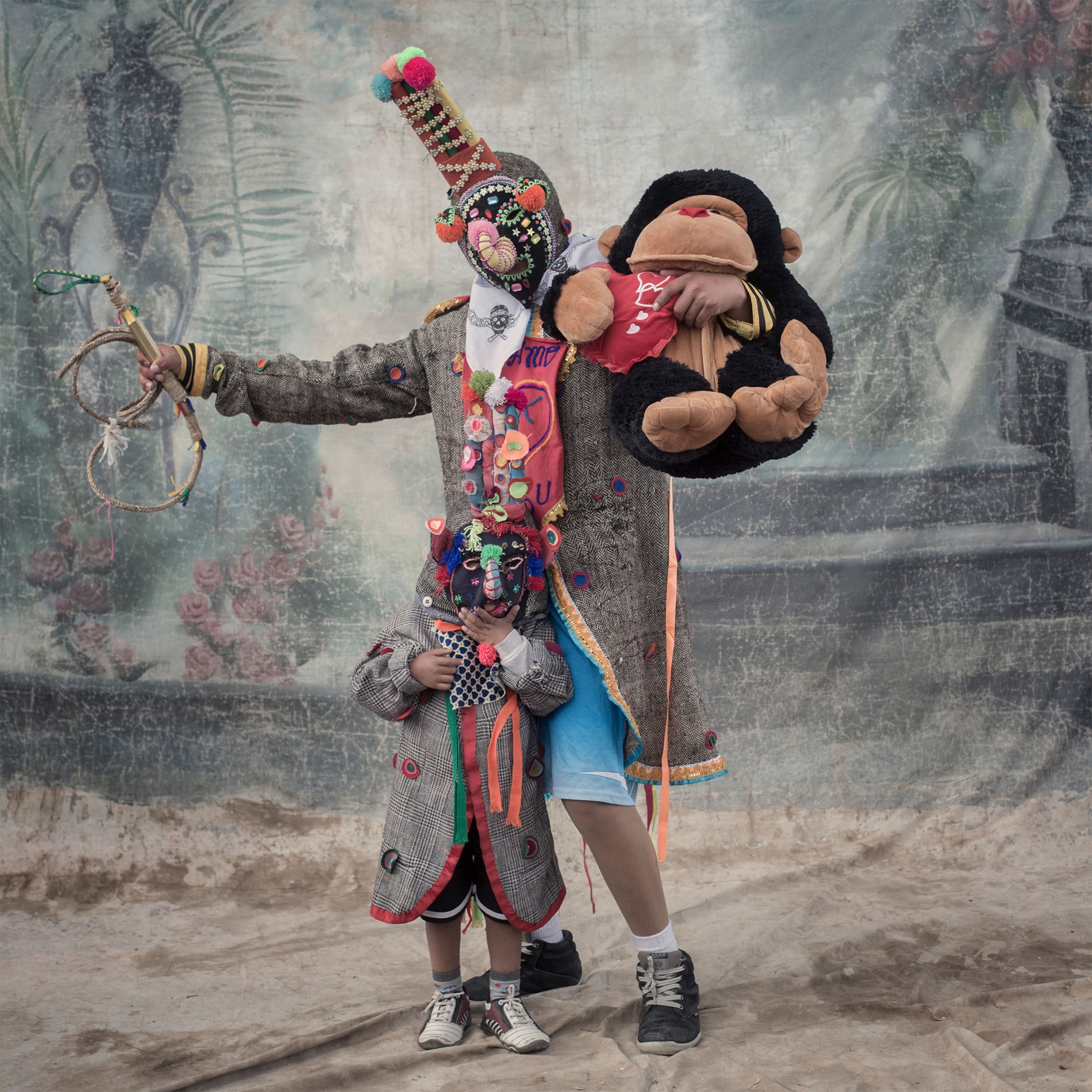 a man and boy in costume during the Candelaria Festival in Peru