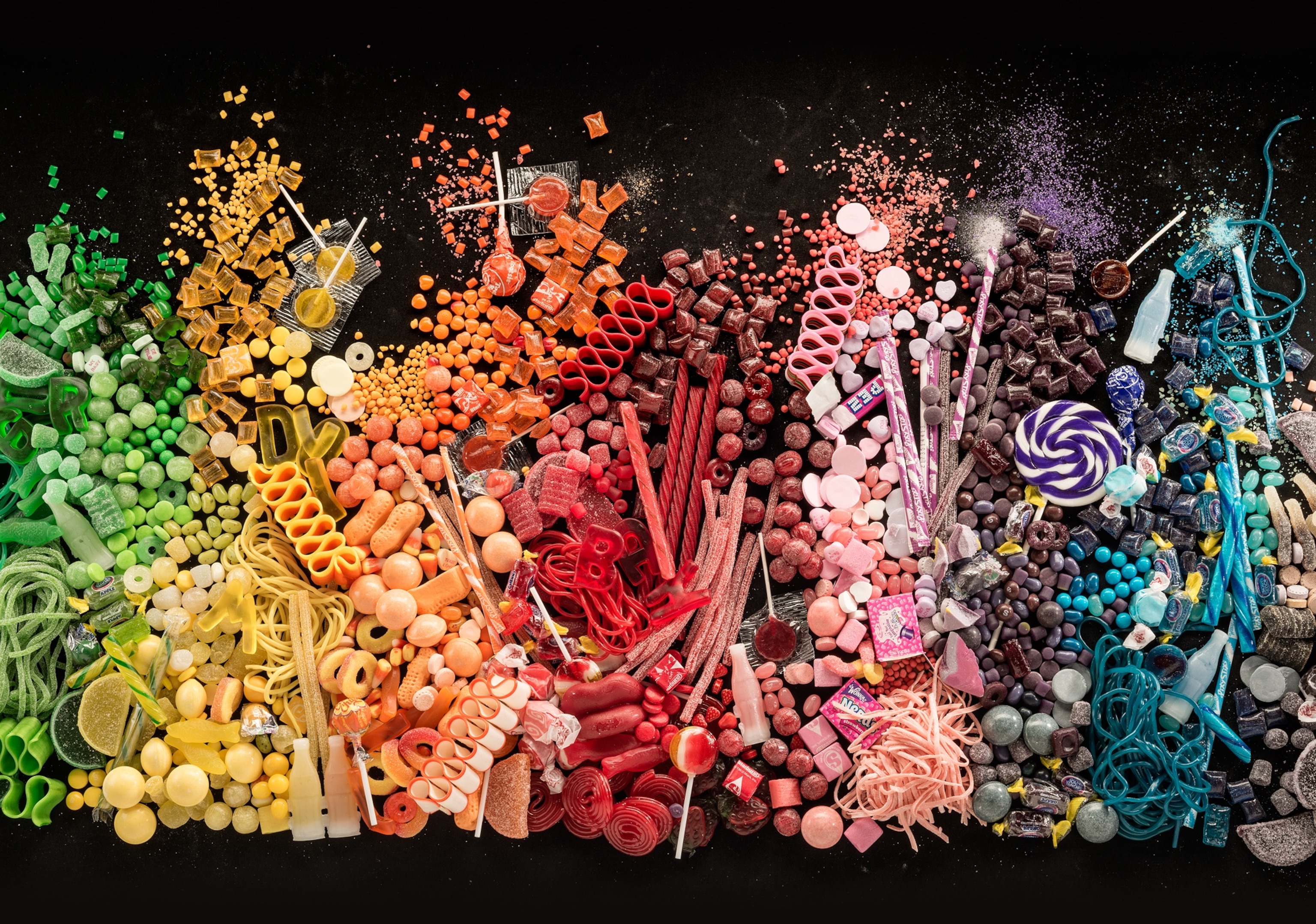 Studio photo of rainbow-colored candies.