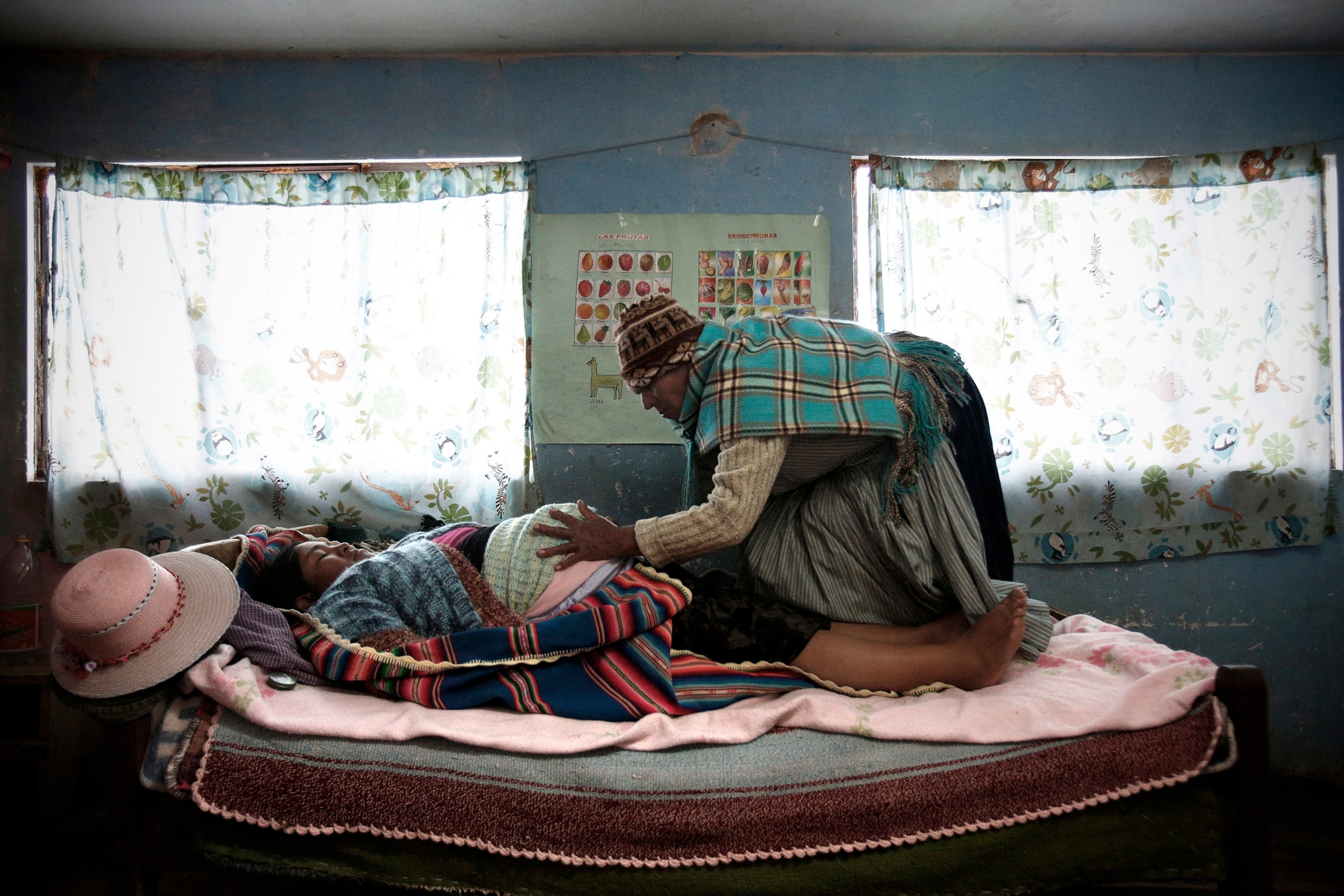 woman helping woman give birth