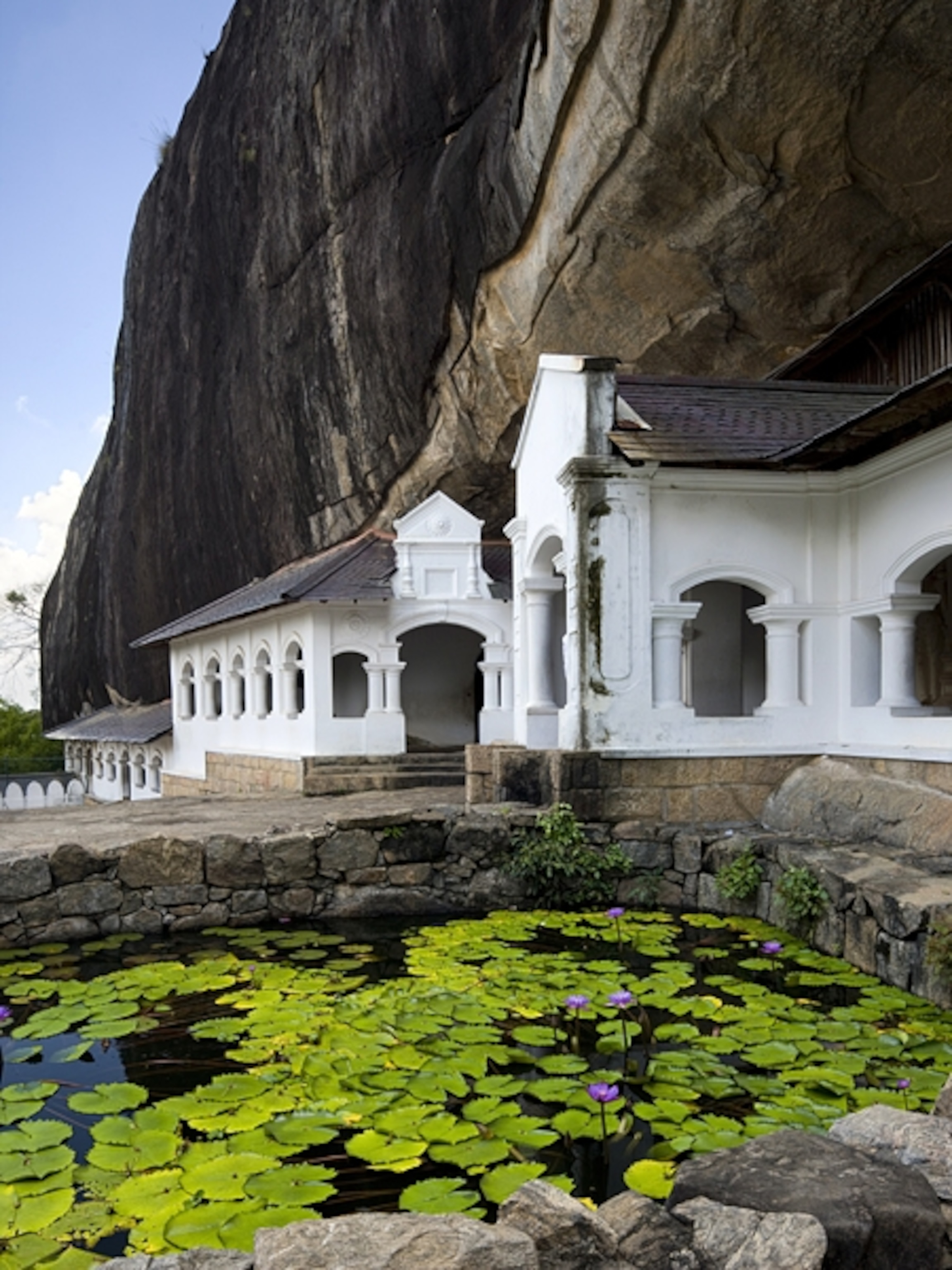Temple in rock wall in Sri Lanka