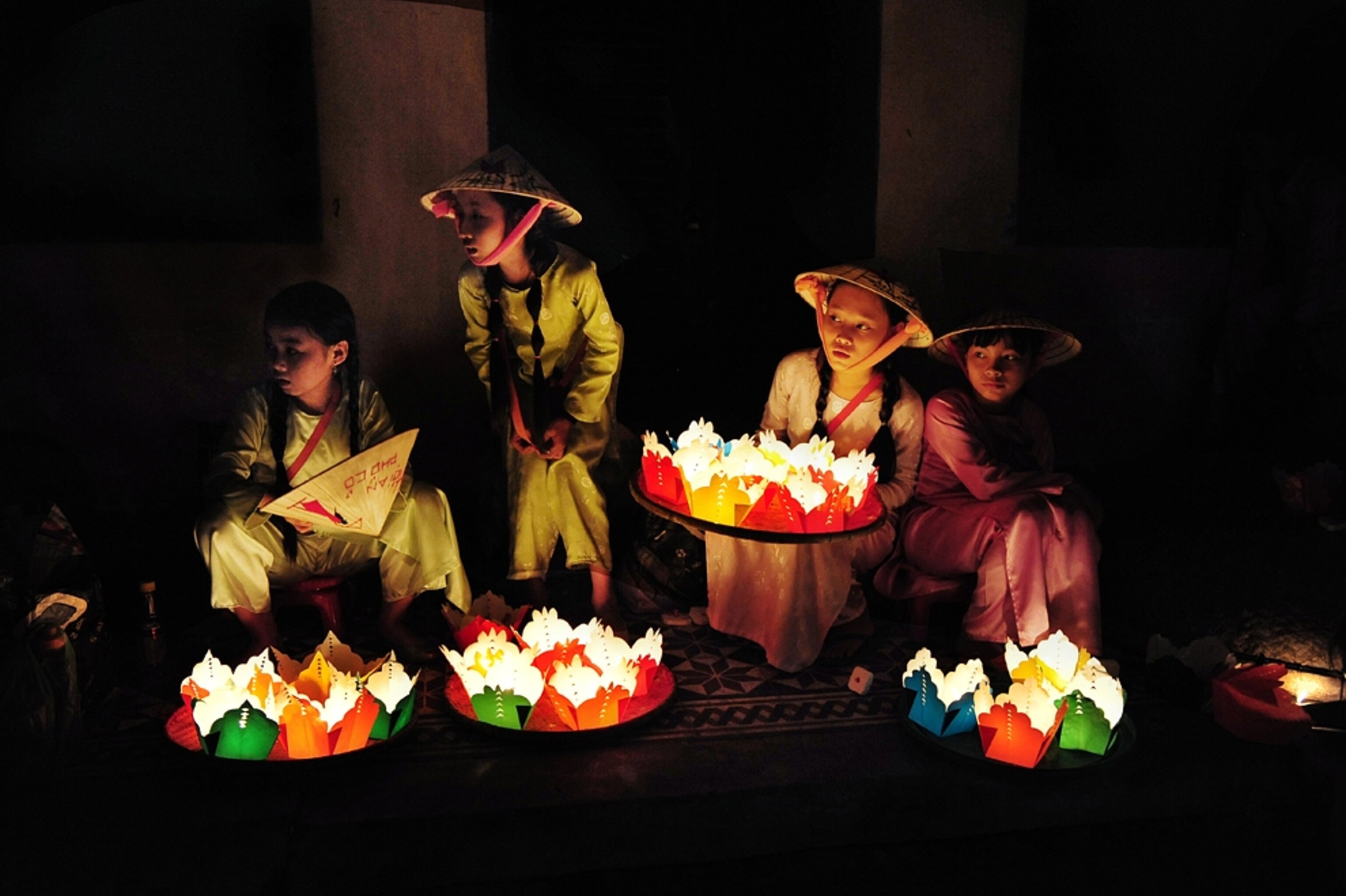 young people selling paper lanterns, Hoi An, Vietnam