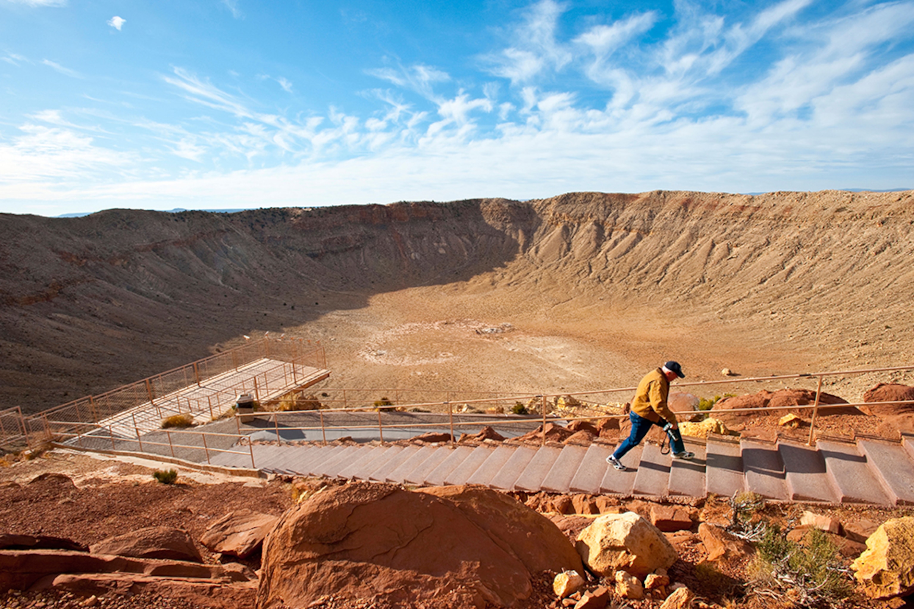 a man hiking out of Meteor Crater near Winslow, Arizona