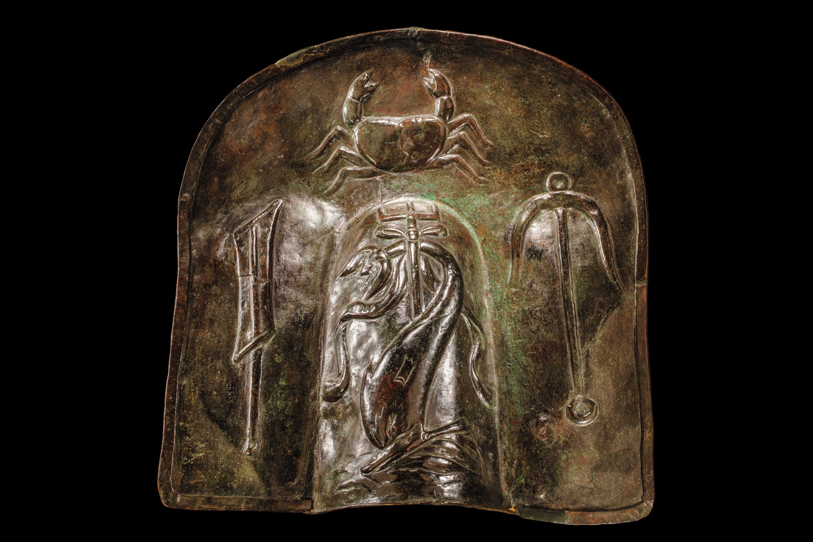 Decorated with marine life, this high neck guard was worn on the shoulder by a retiarius, who fought with a net and trident.