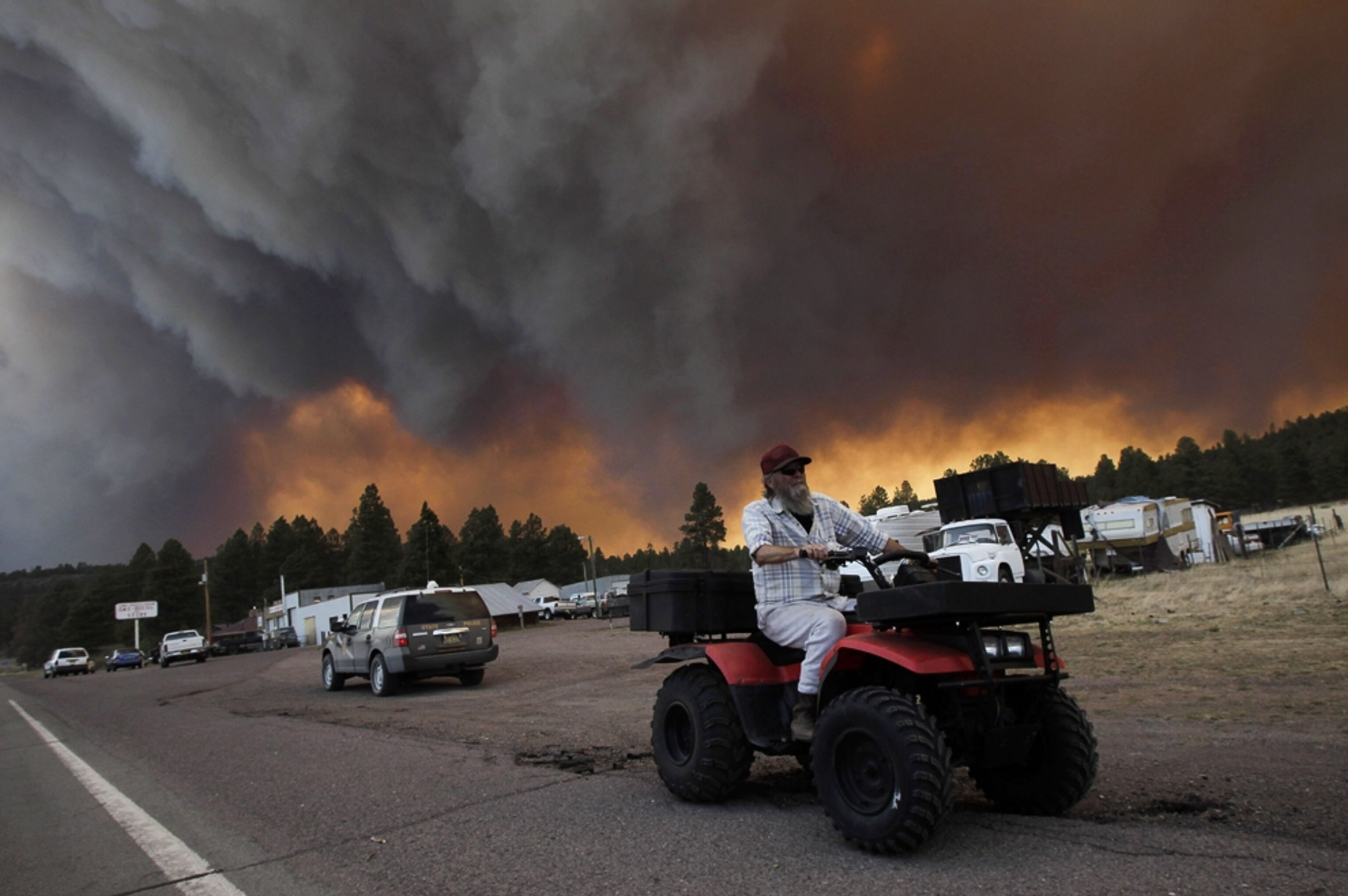 a man riding his ATV near the Arizona wildfire