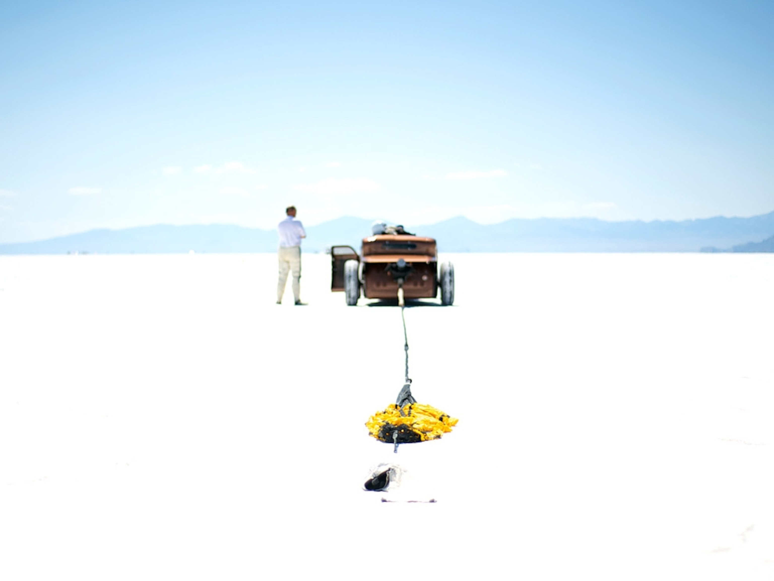 Deflated parachute behind car