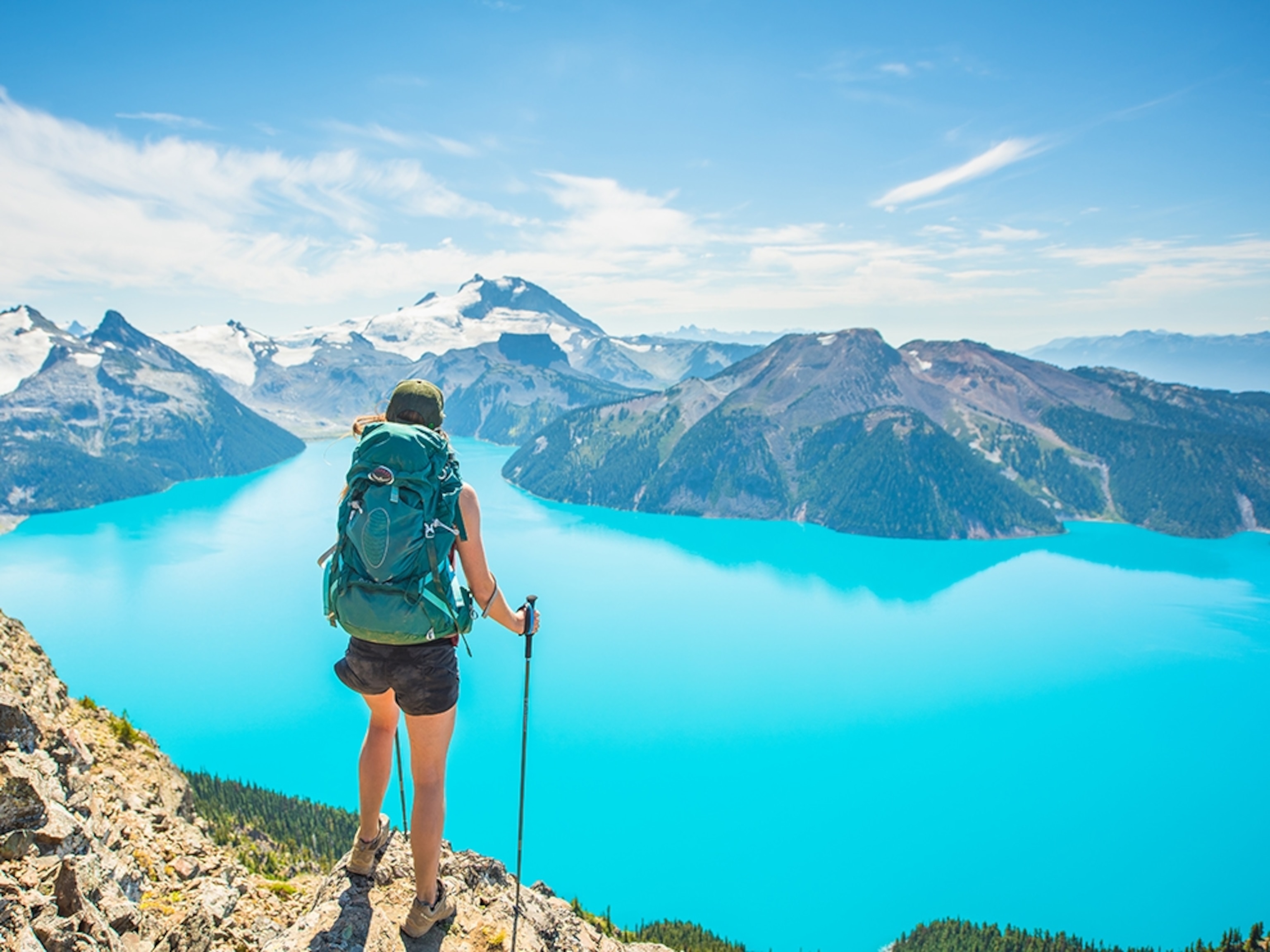 a hiker looking out at a lake