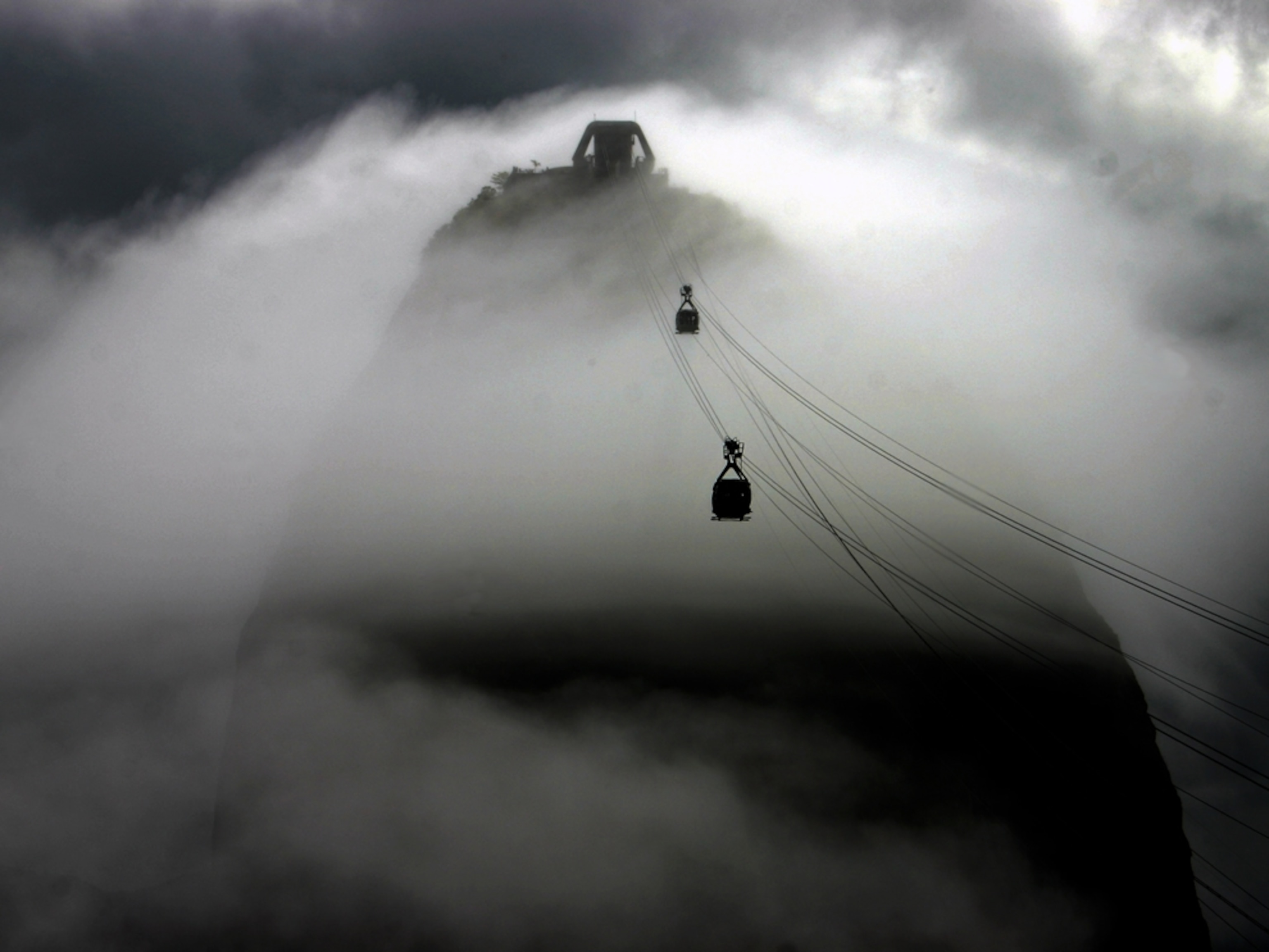 Cable cars ascending a mountain
