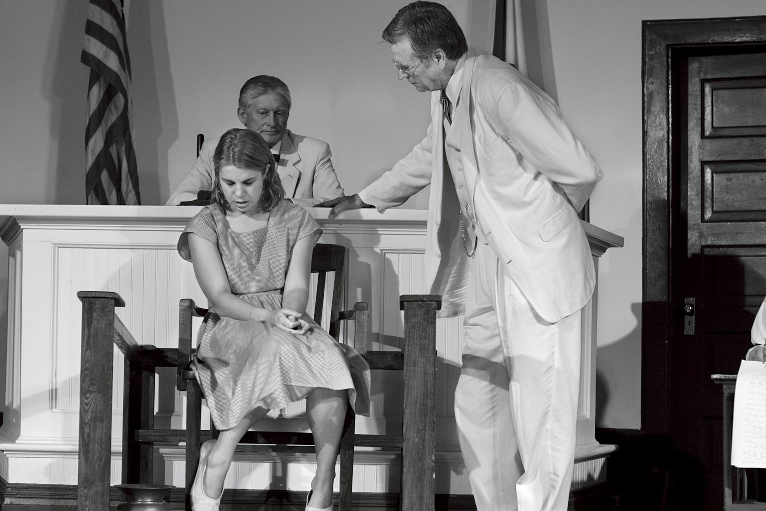 Characters Atticus Finch and Mayella Ewell during the courtroom scene.