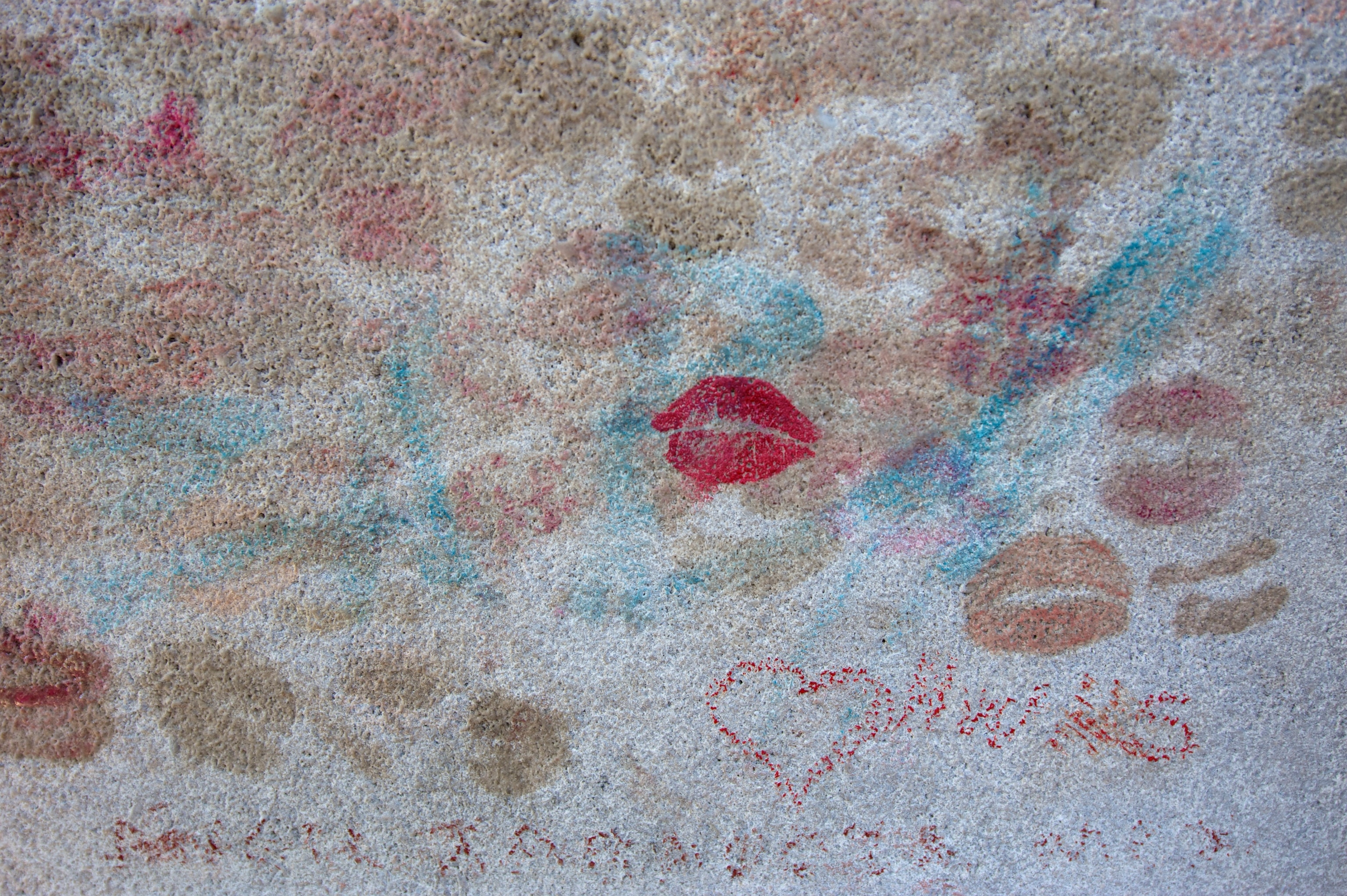 Close up of Oscar Wilde's tombstone at Pere Lachaise cemetery.