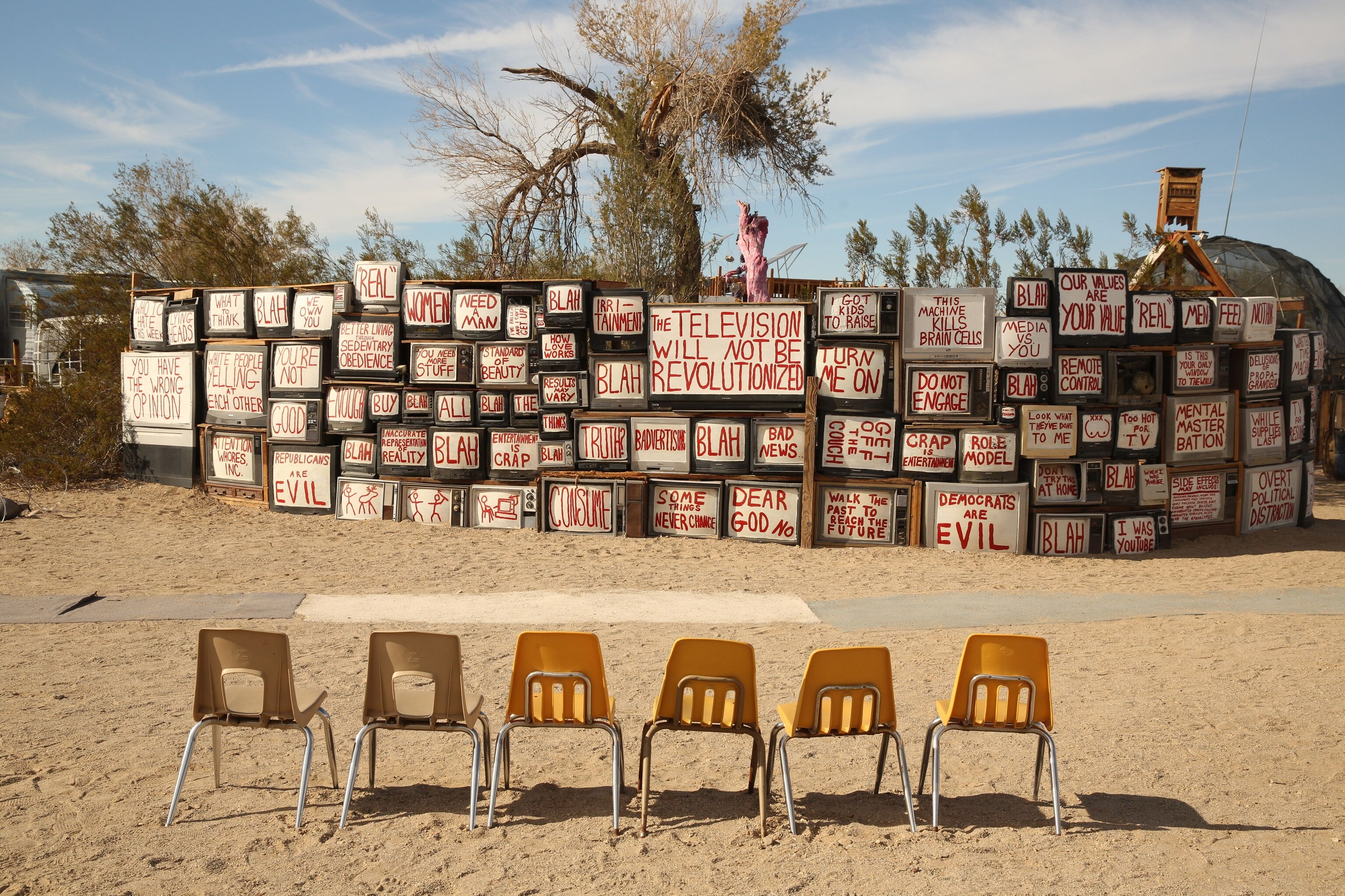 a wall of TVs in East Jesus, Slab City, California