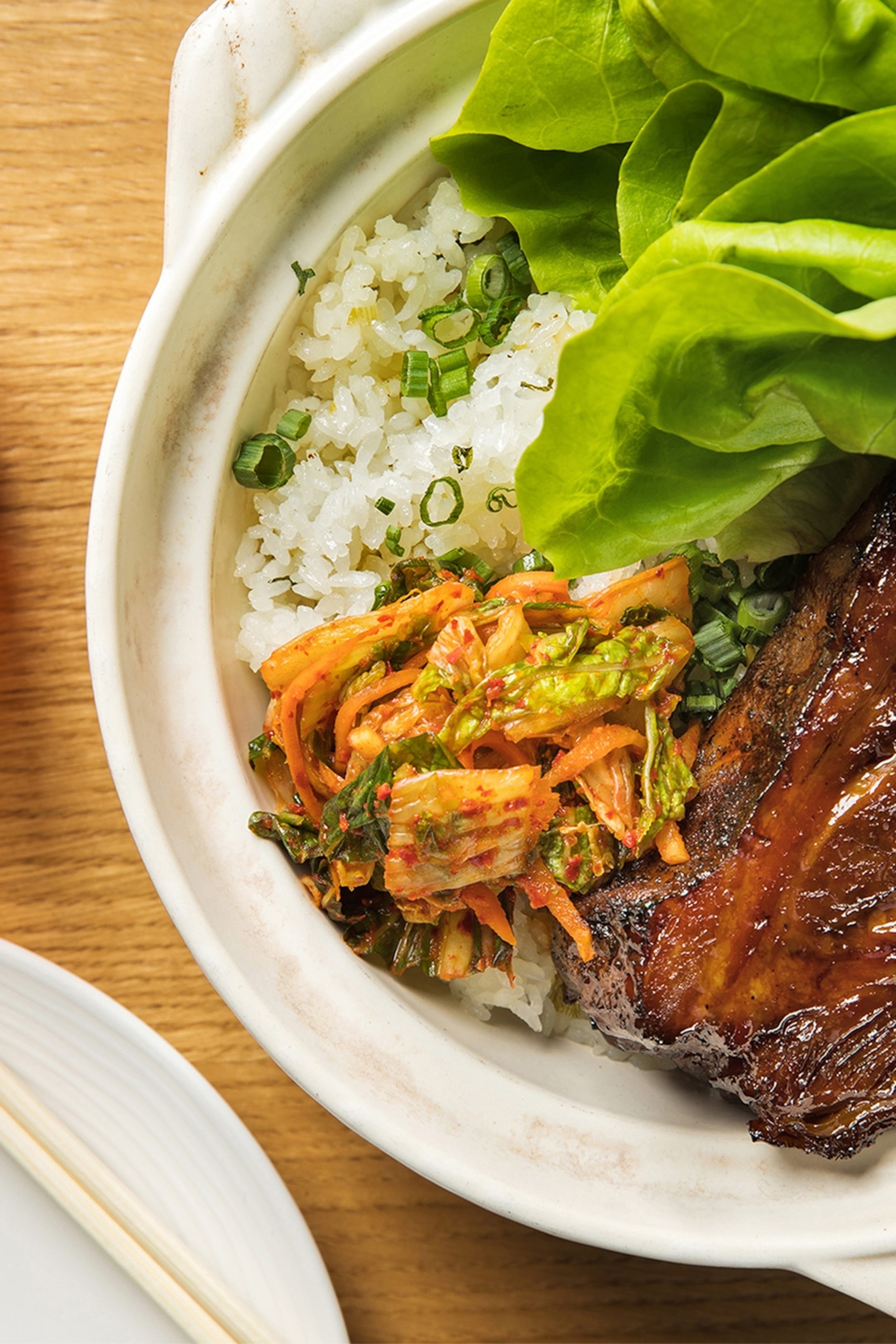 Plate with glazed meat. rice and greens