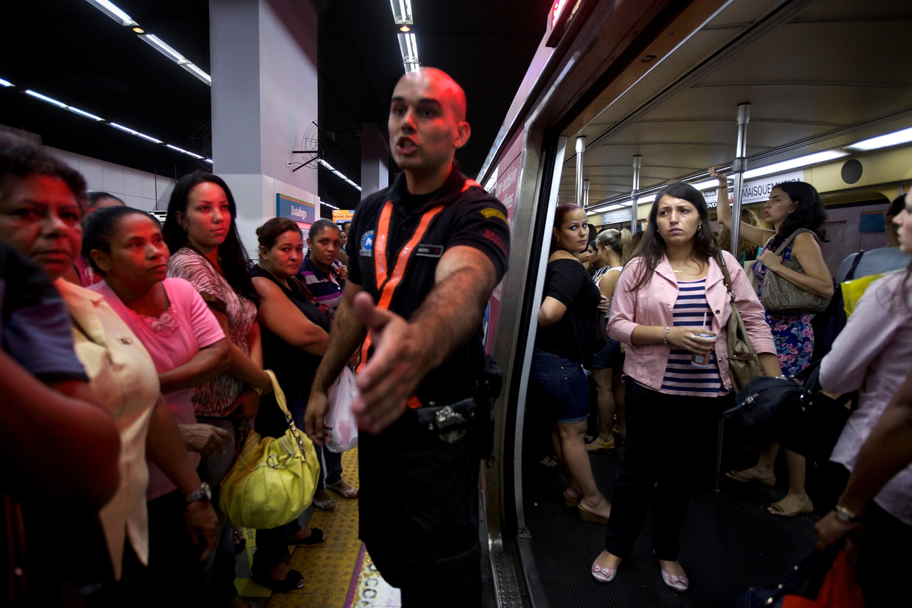 a security guard keeping men off the female-only car on the Rio De Janeiro Metro