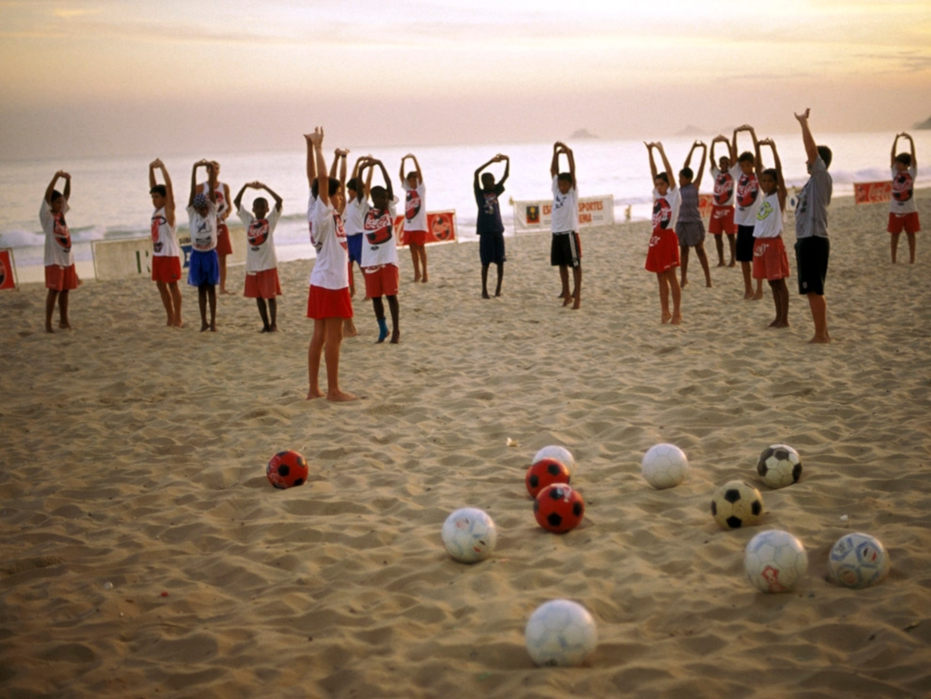 Beach soccer school for children.