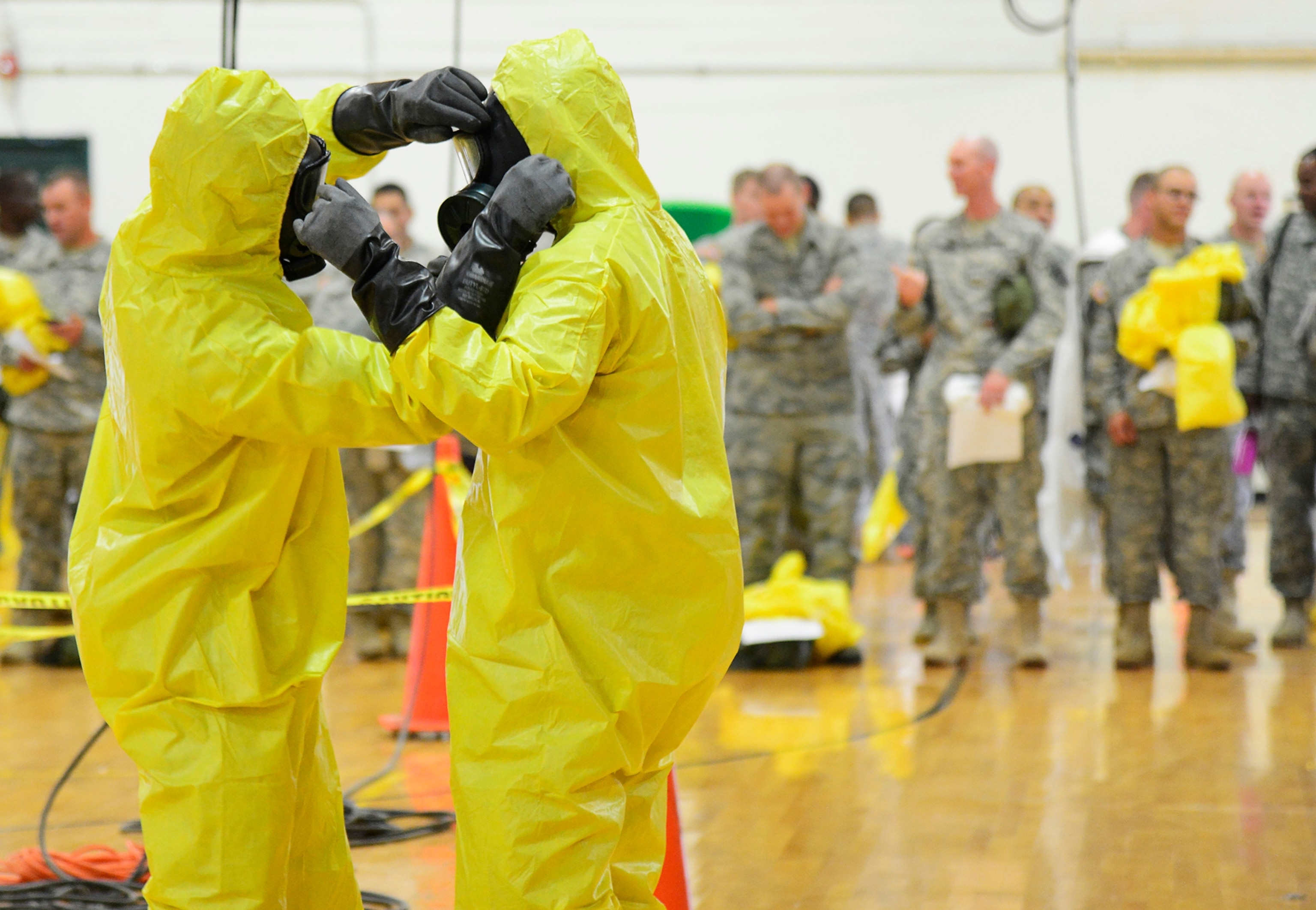 A member of the CG Environmental HazMat team disinfects the entrance to the residence of a health worker at the Texas Health Presbyterian Hospital who has contracted Ebola in Dallas, Texas, October 12, 2014.