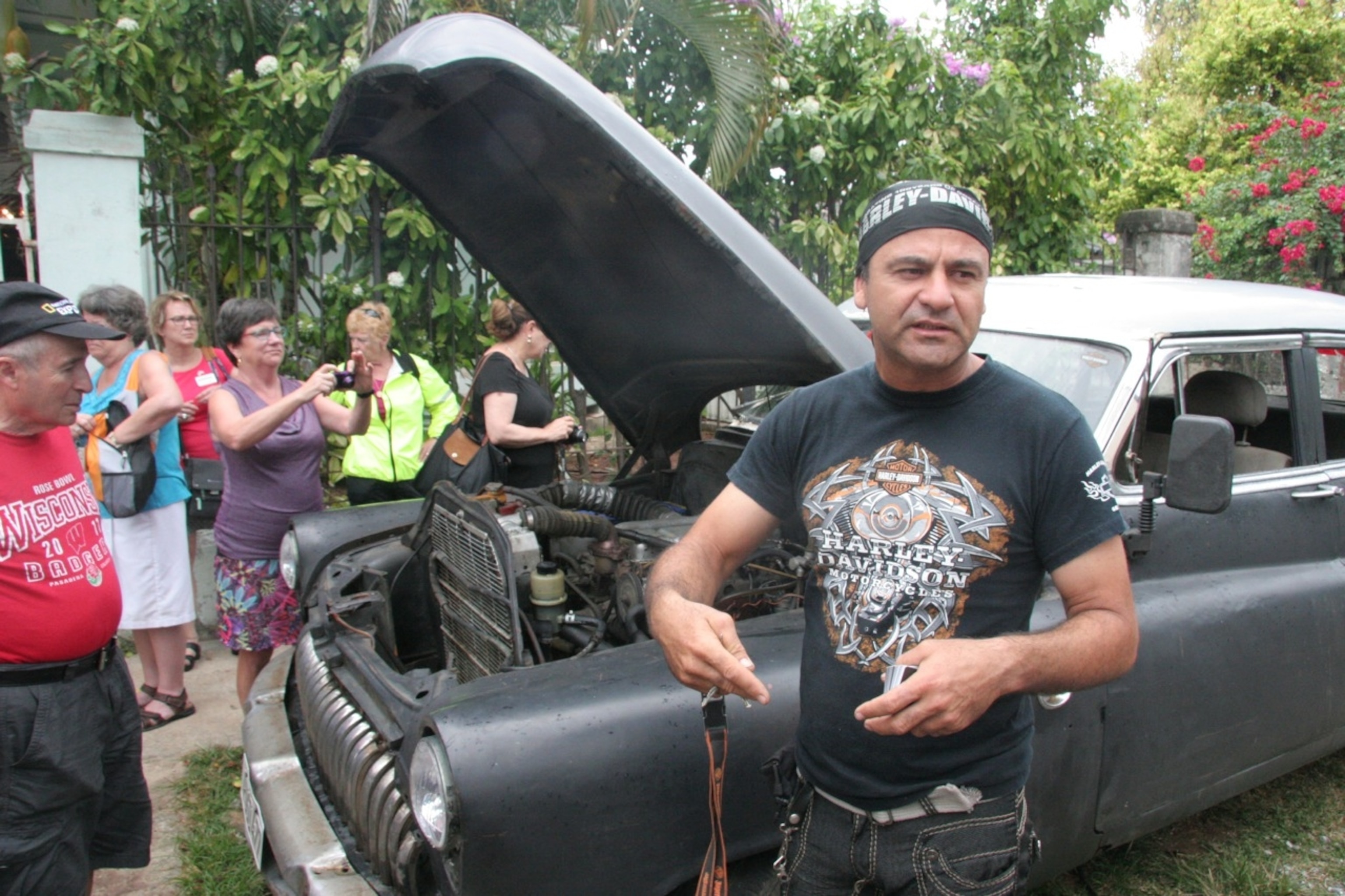 Luis shows us his old Buick, dating back to the 1950's, which he keeps running using old Soviet and Japanese car parts. (Photo by Andrew Evans, National Geographic Travel)