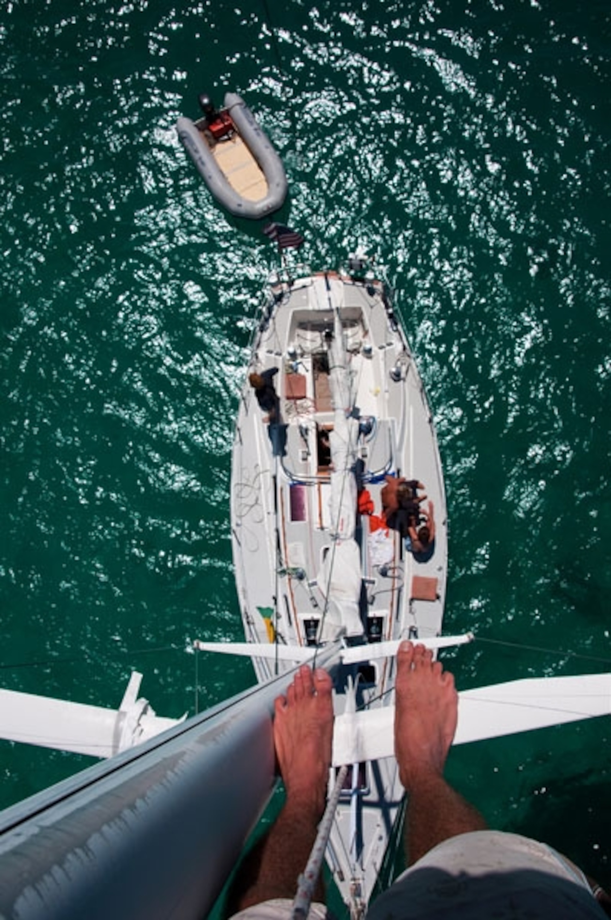 A view looking down from a boat's mast to the water of the Tobago Cays
