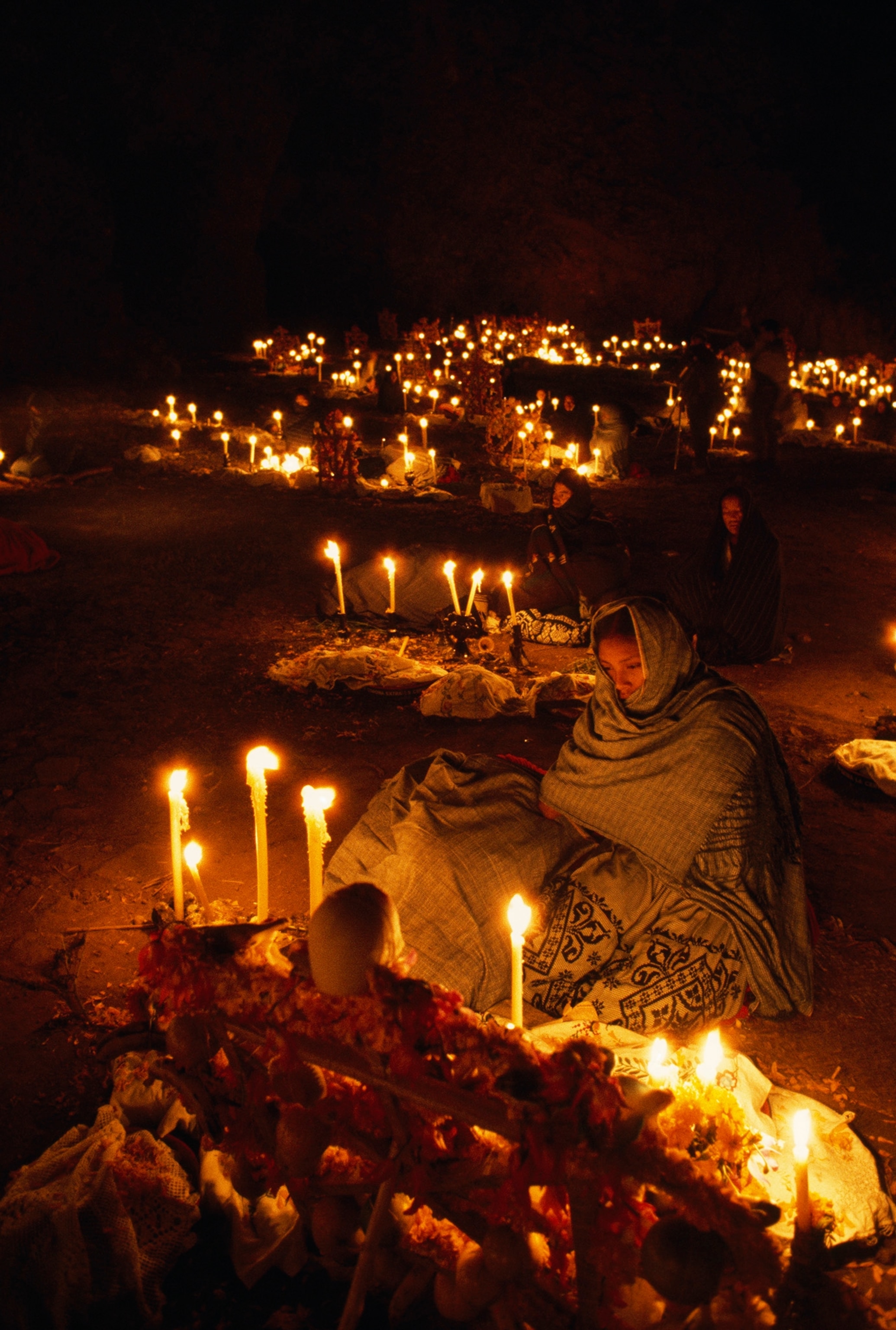 Candles light cemetery during Day of the Dead ceremony on Janitzio Island in Lake Patzcuaro, Mexico.