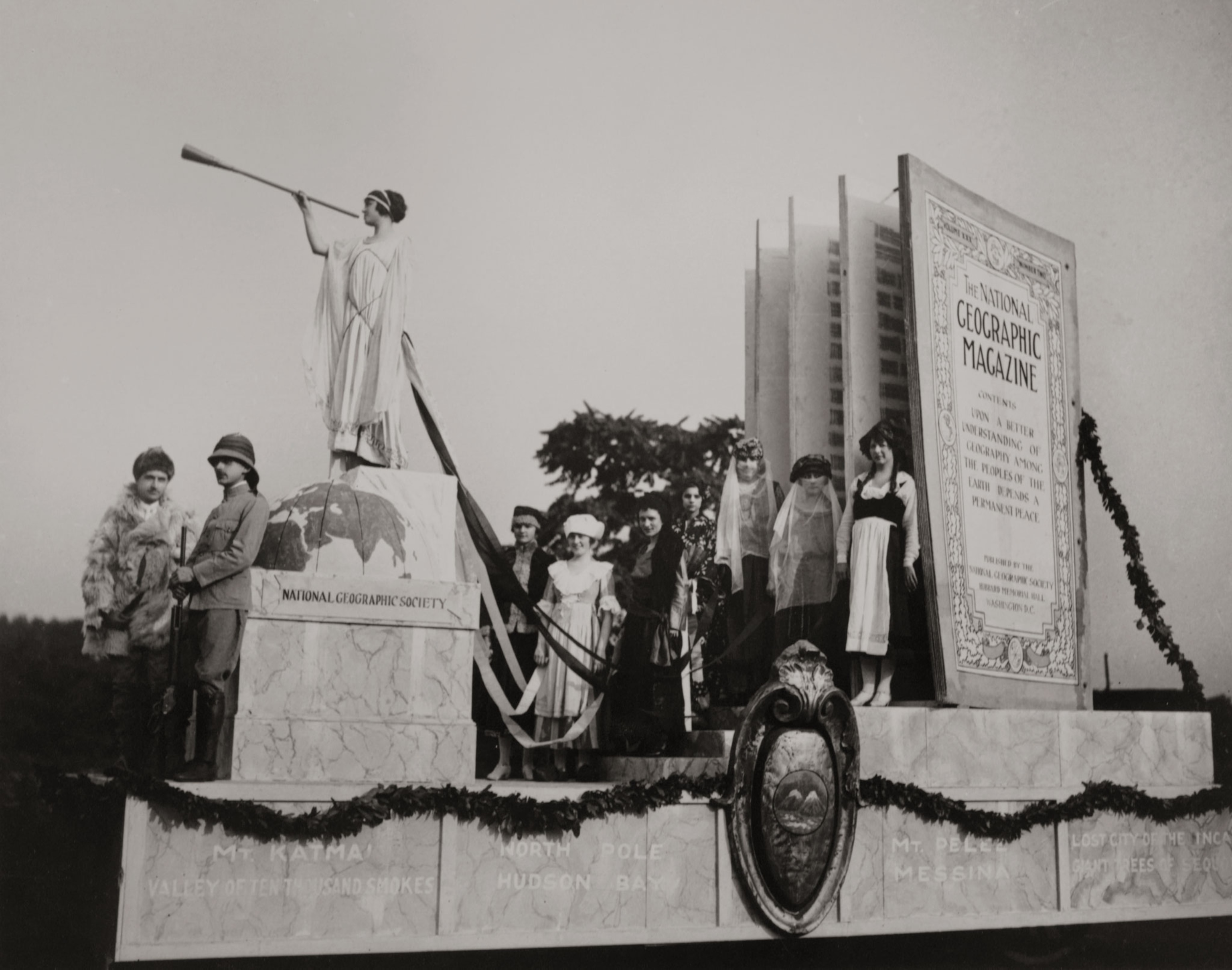 people on a float featuring National Geographic Magazine