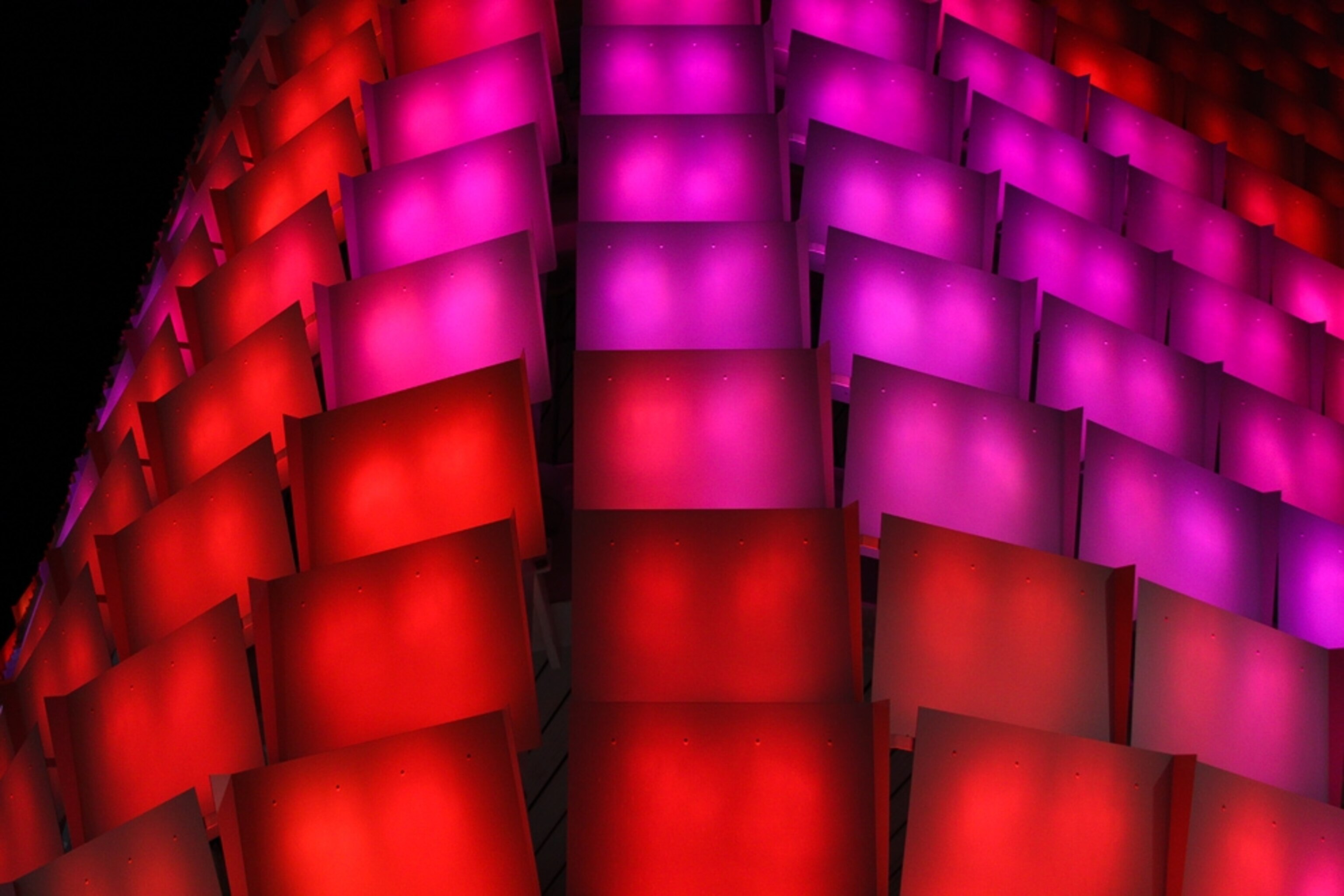A grid of red and pink illuminated panels