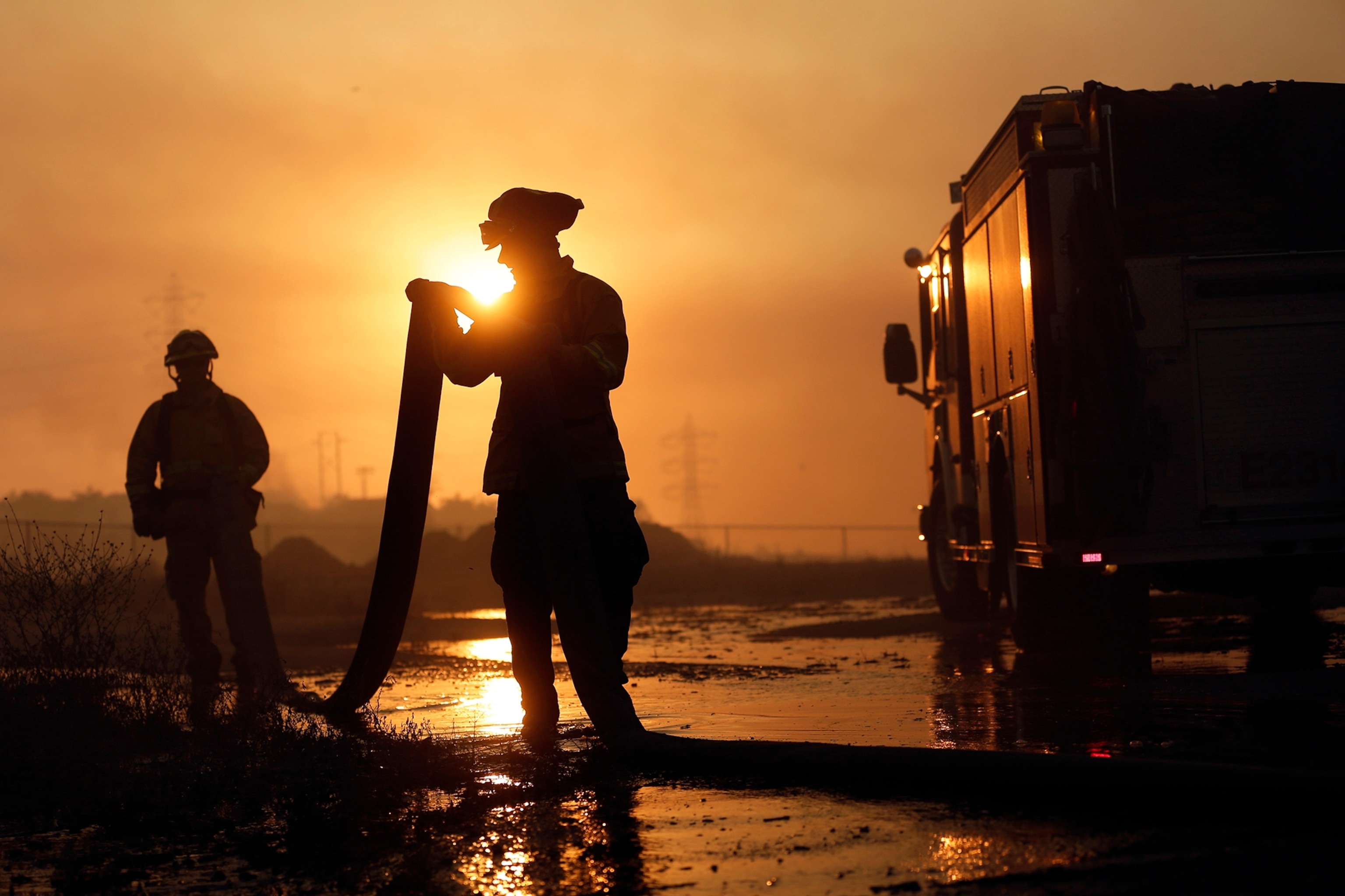 Wildfire climbs a canyon toward homes Wednesday, May 14, 2014, in Carlsbad, Calif.