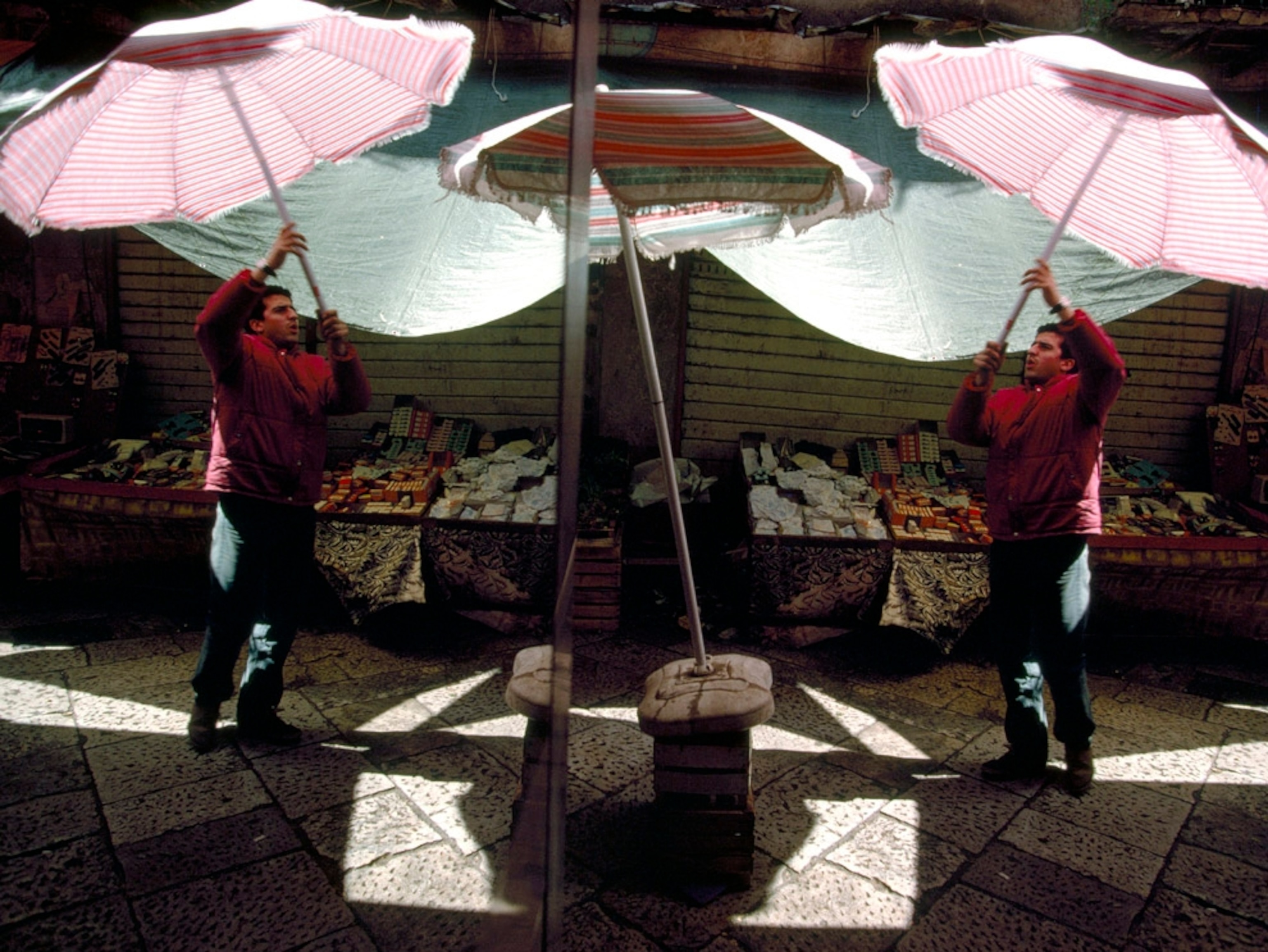 A stalk is reflected in the window at Vucciria marketplace