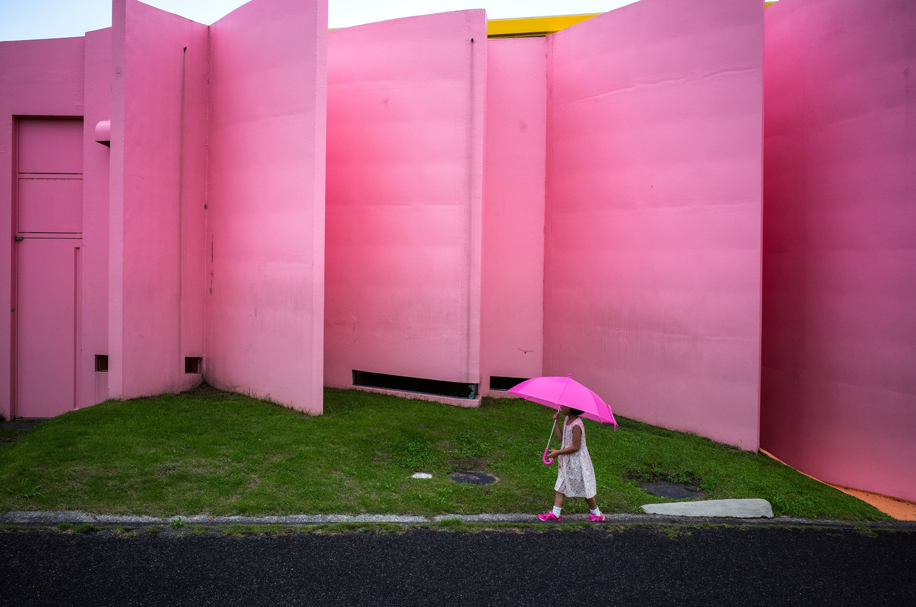 a young girl dressed in pink near a pink sculpture Yoro Park, Gifu, Japan