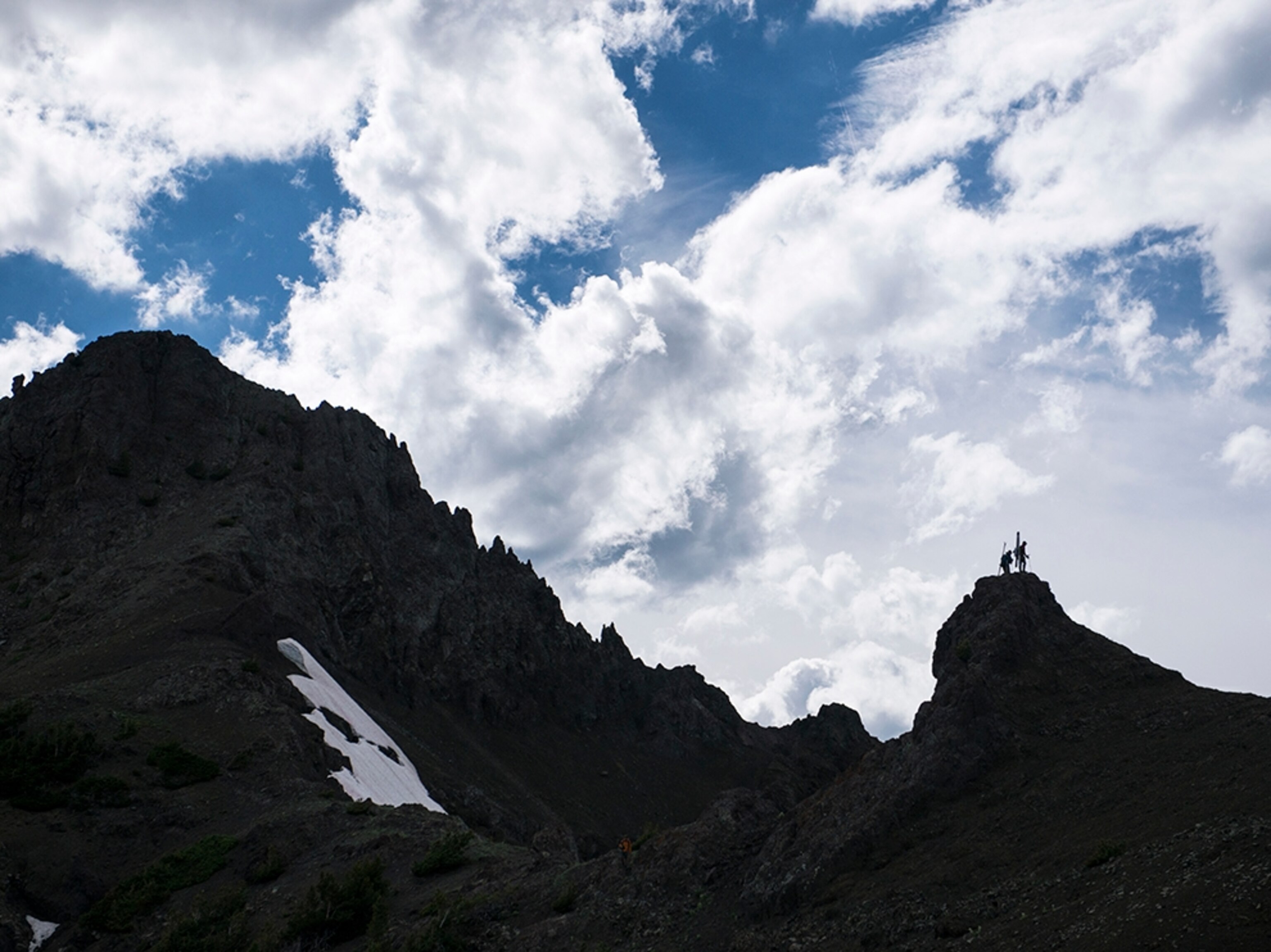 hikers on a peak in the Beartooth Mountains