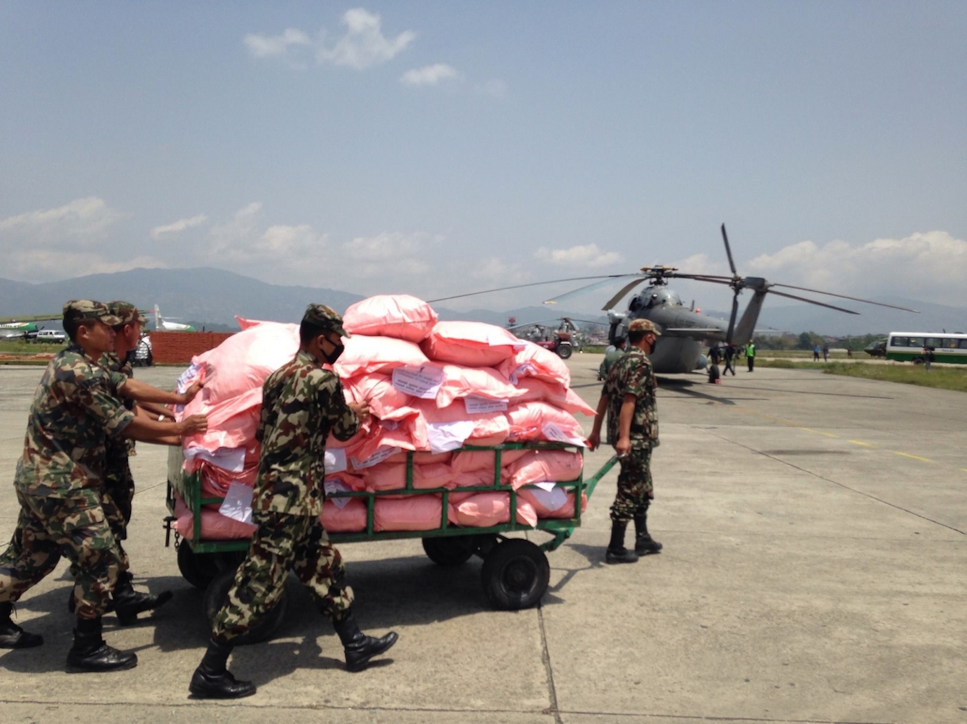Clear weather allowed lots of flights to get in and out. These bags of supplies were loaded onto the helicopter that brought in an injured child; Photograph by Libby Sauter