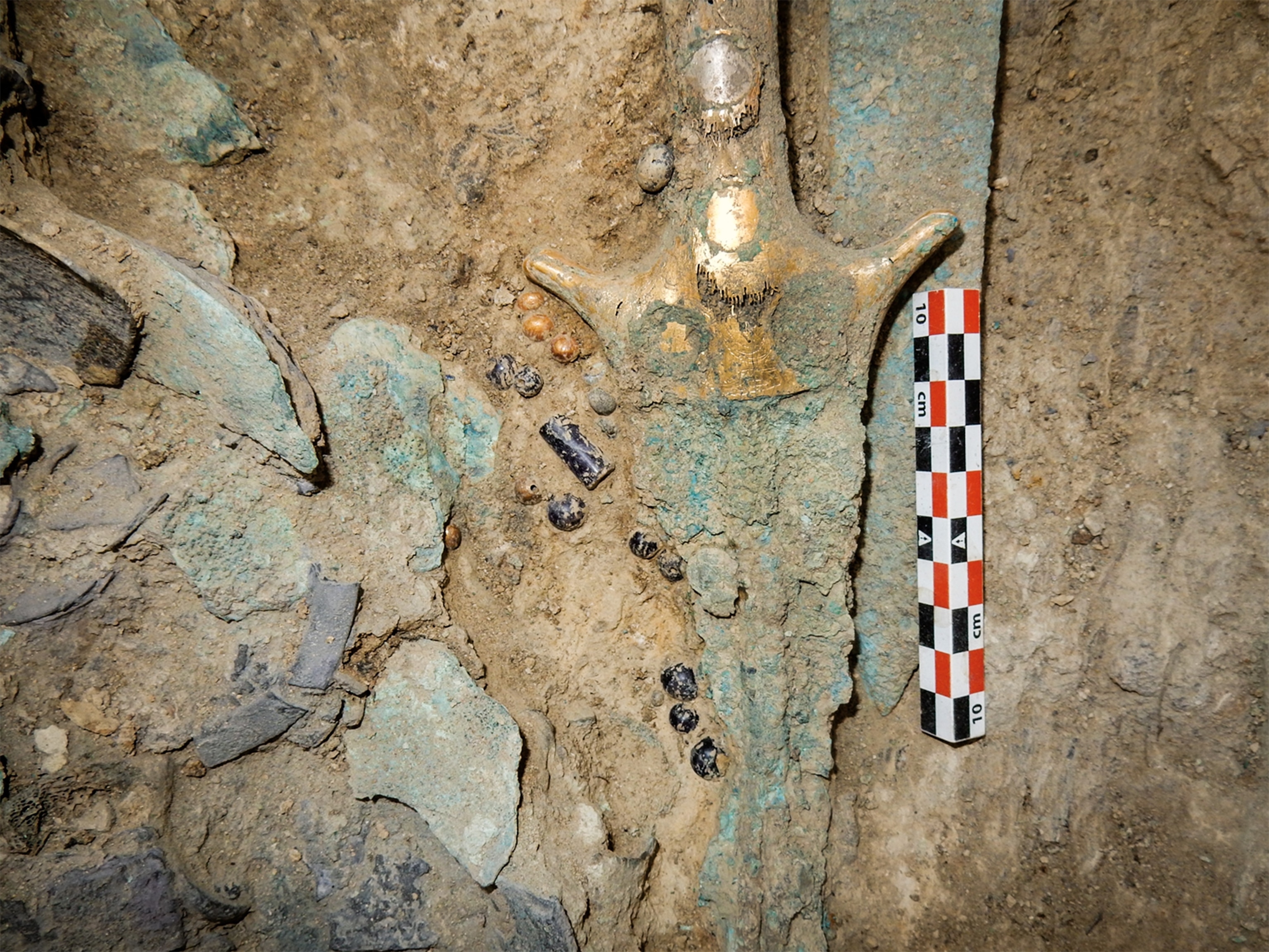 The sword as it was discovered in the Griffin Warrior's tomb in Pylos.
