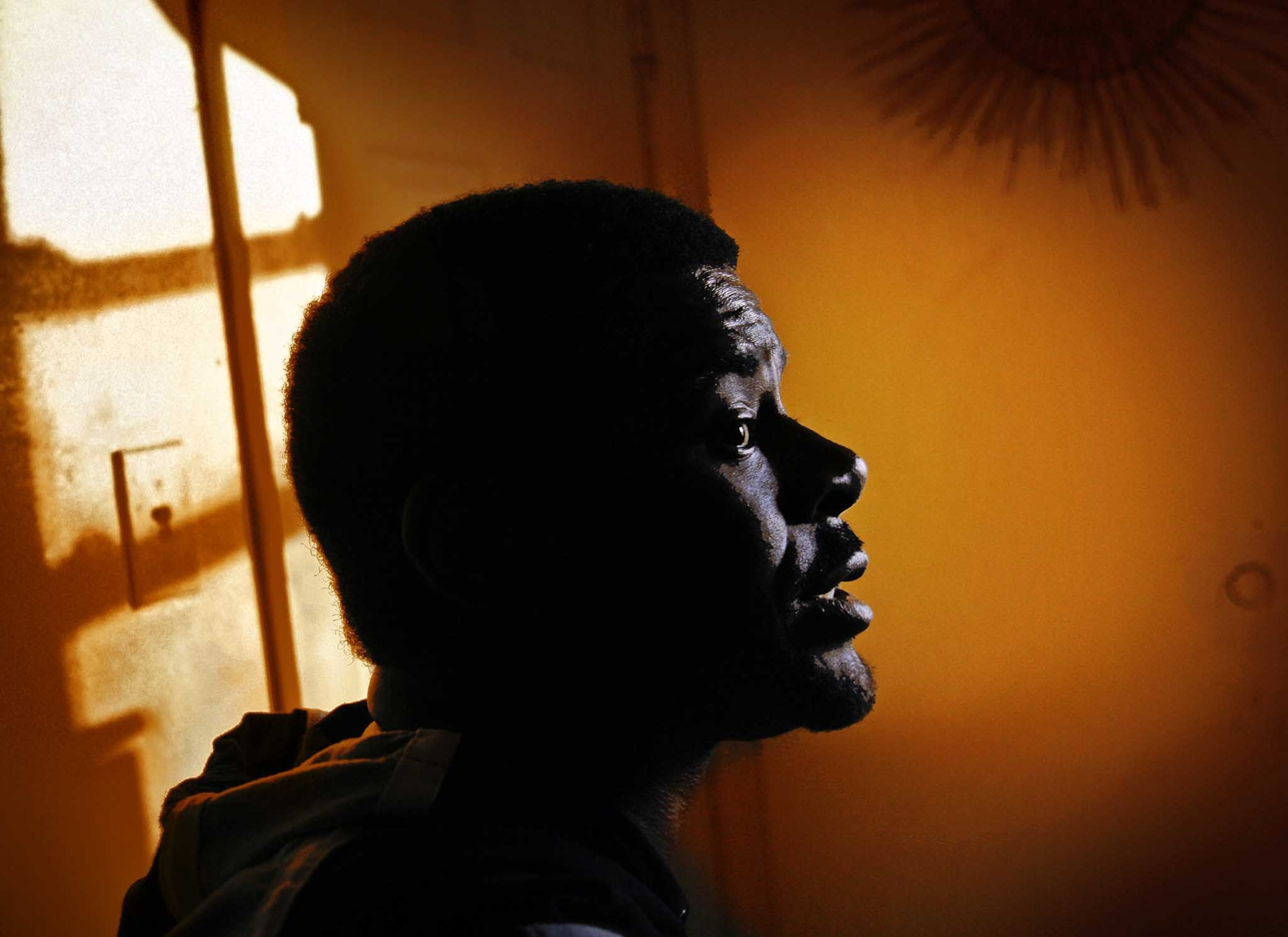 Blackmen who live the thug life of crime, drug dealing and gun play; imprisonment or death is often the result. Illuminated by the afternoon sun, Anthony James, 36, is on probation and is in the CSOSA(Court Services and Offender Supervision Agency) program, is pictured at his aunts house.