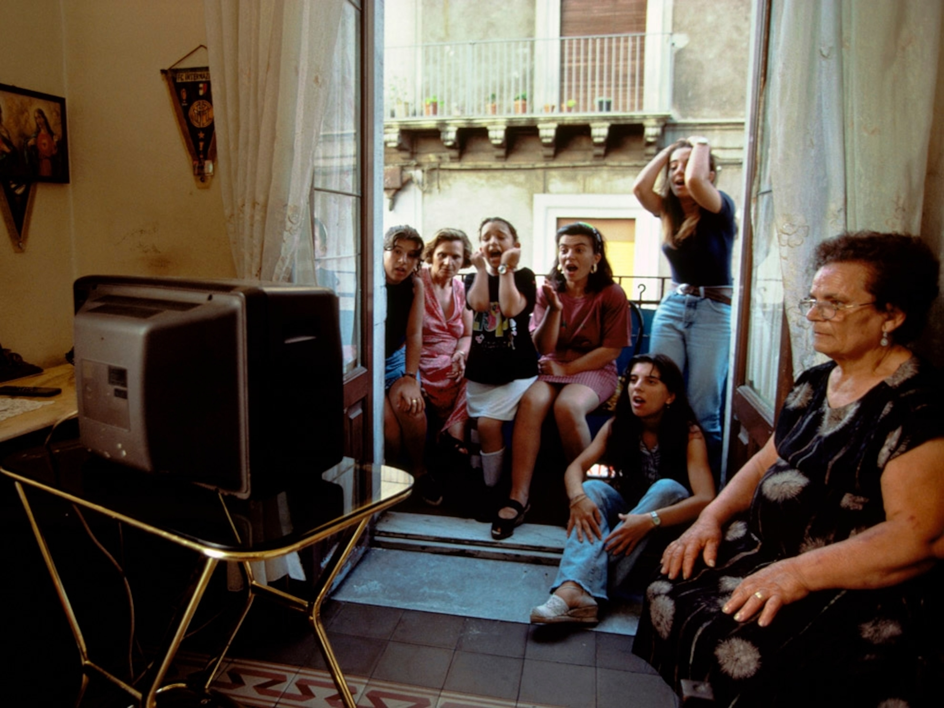 Women gather the watch Italy's World Cup soccer team