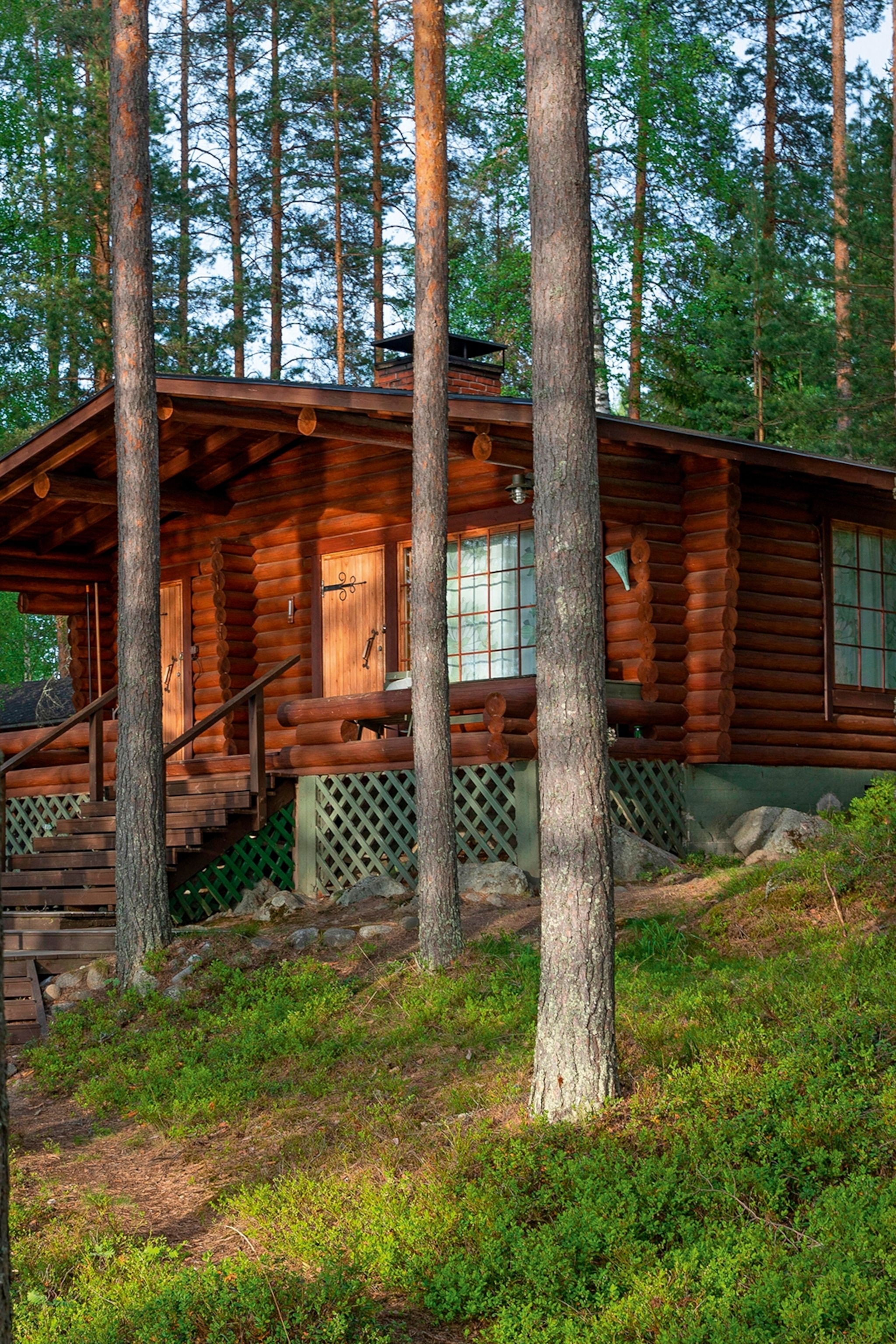 Wooden chalet in the trees.
