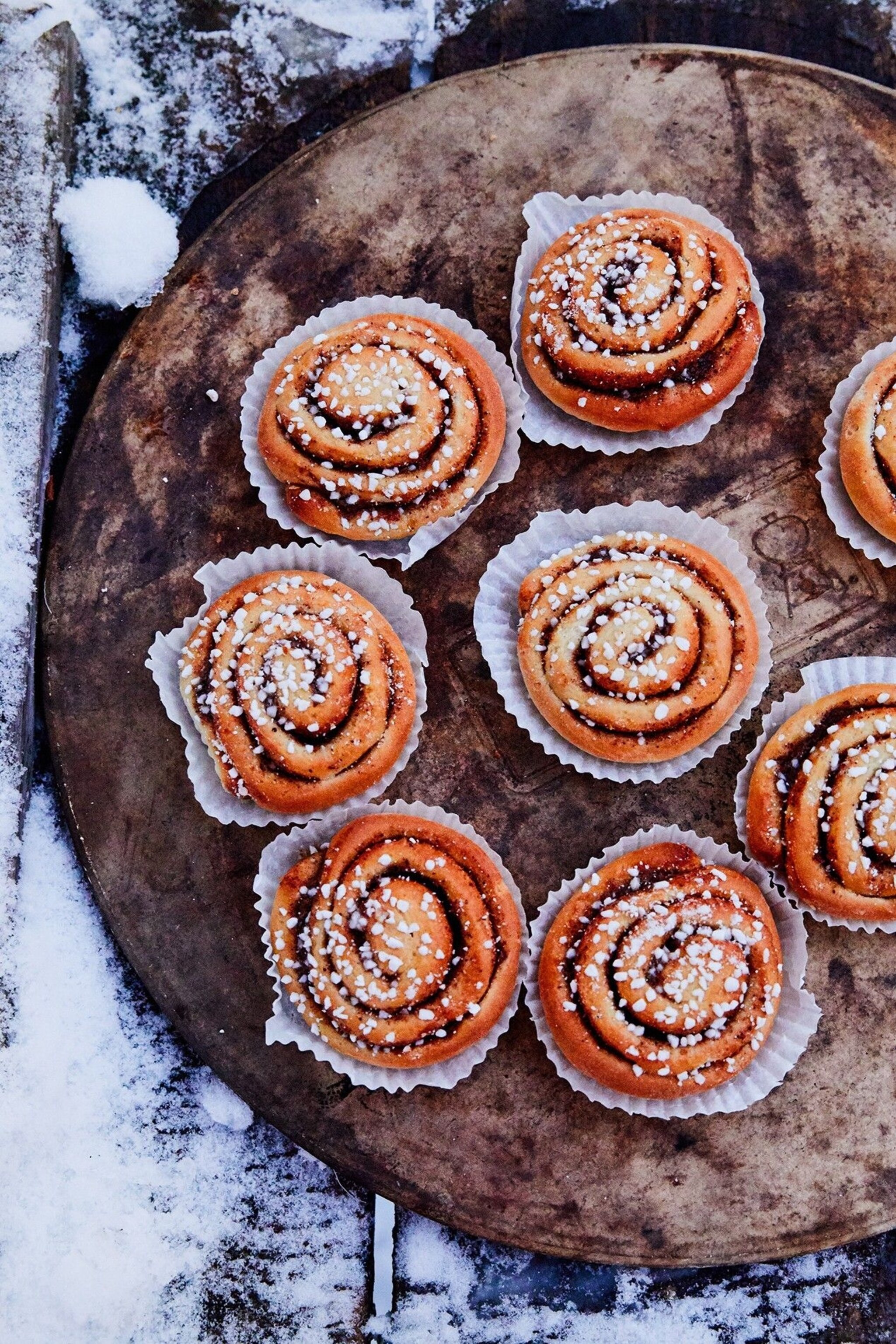 Here, camp co-founder Jonas Gejke prepares an afternoon fika (a coffee and cake break) that includes waffles, cooked on a cast iron griddle and served with cloudberry jam, and cinnamon buns.